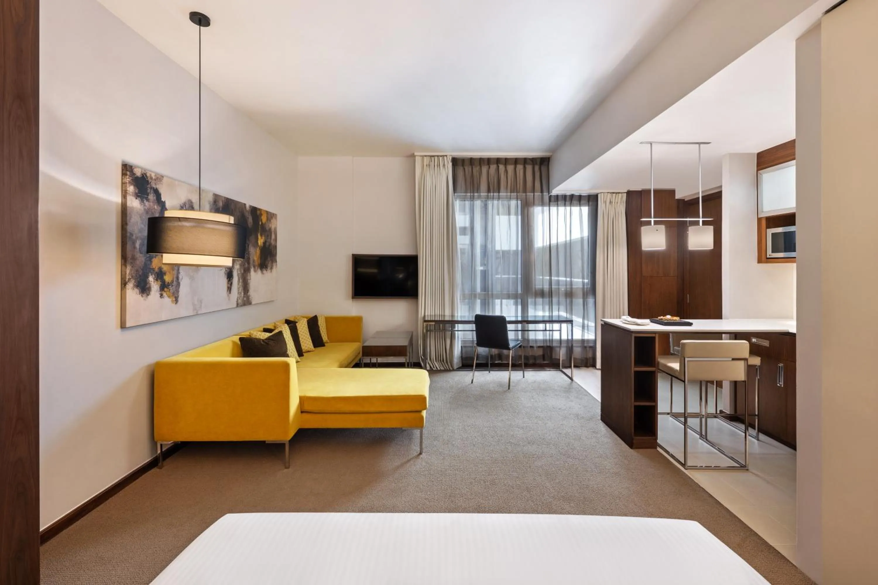 Seating area, Bed in Centro Capital Doha - By Rotana