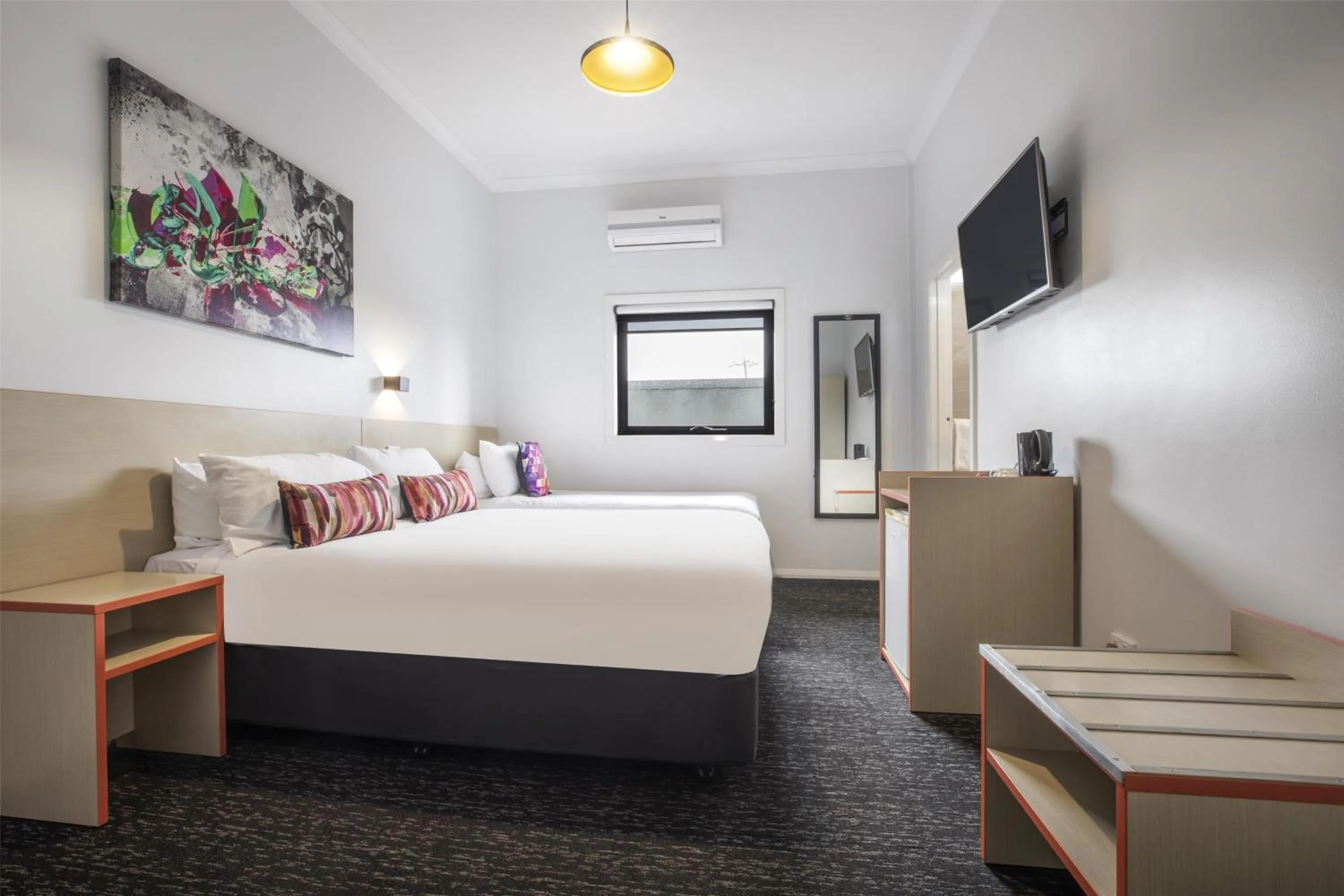 Bedroom, Bed in Nightcap at Ashley Hotel