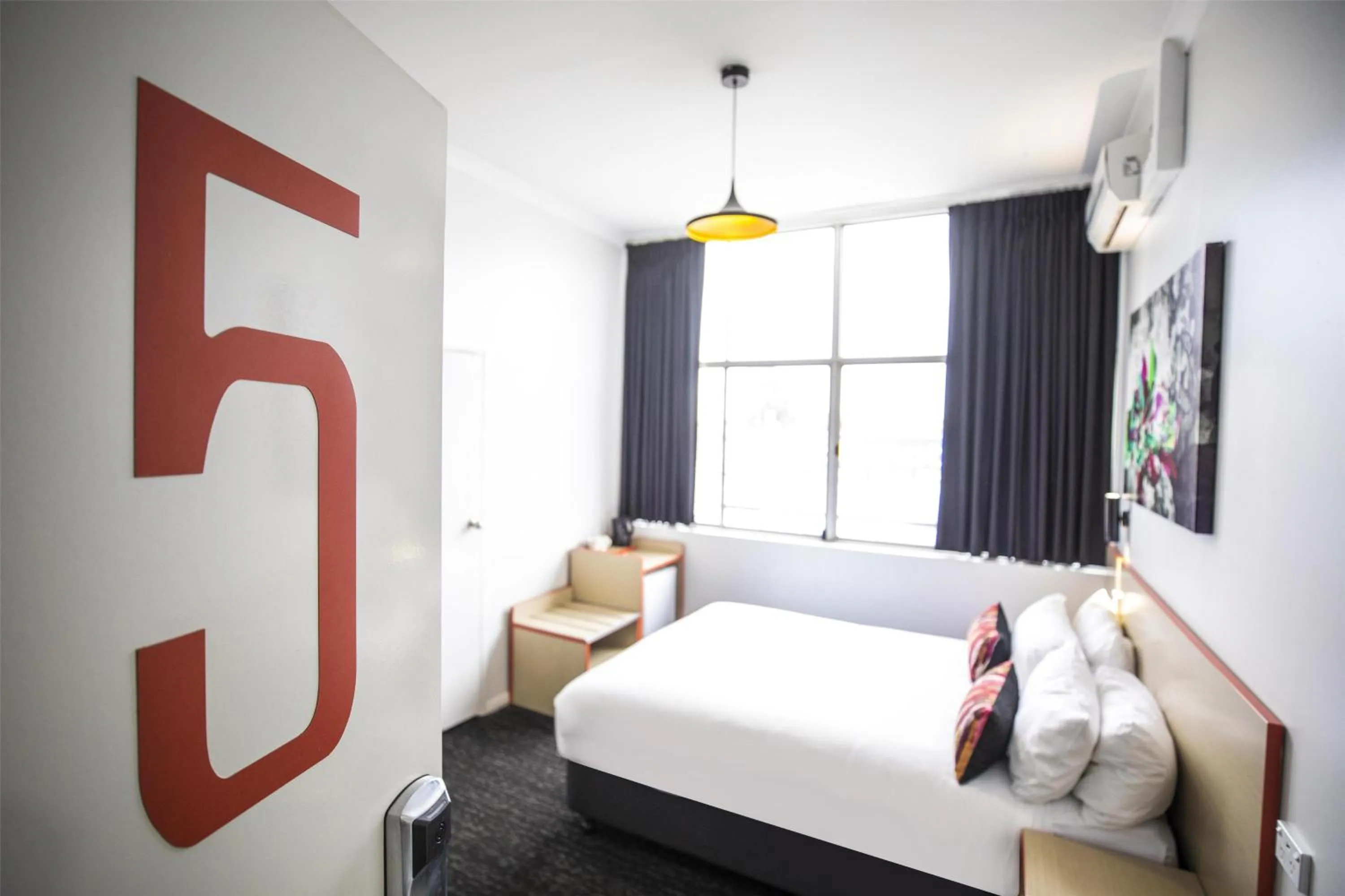 Bedroom, Bed in Nightcap at Ashley Hotel