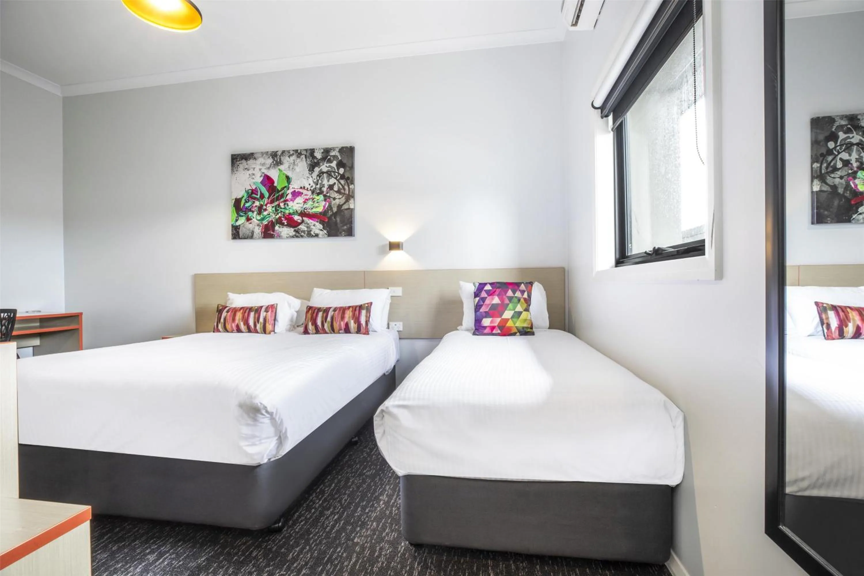 Bedroom, Bed in Nightcap at Ashley Hotel