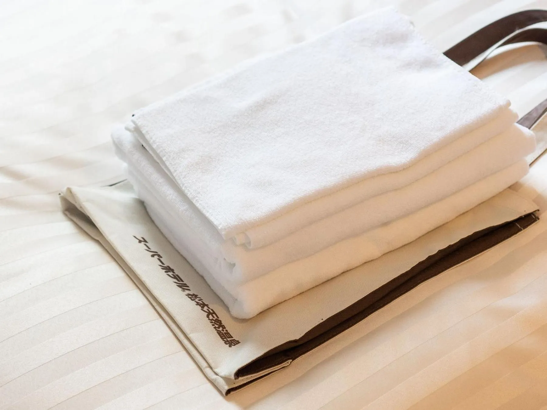 Bed in SUPERHOTEL Matsumoto Oshiroguchi