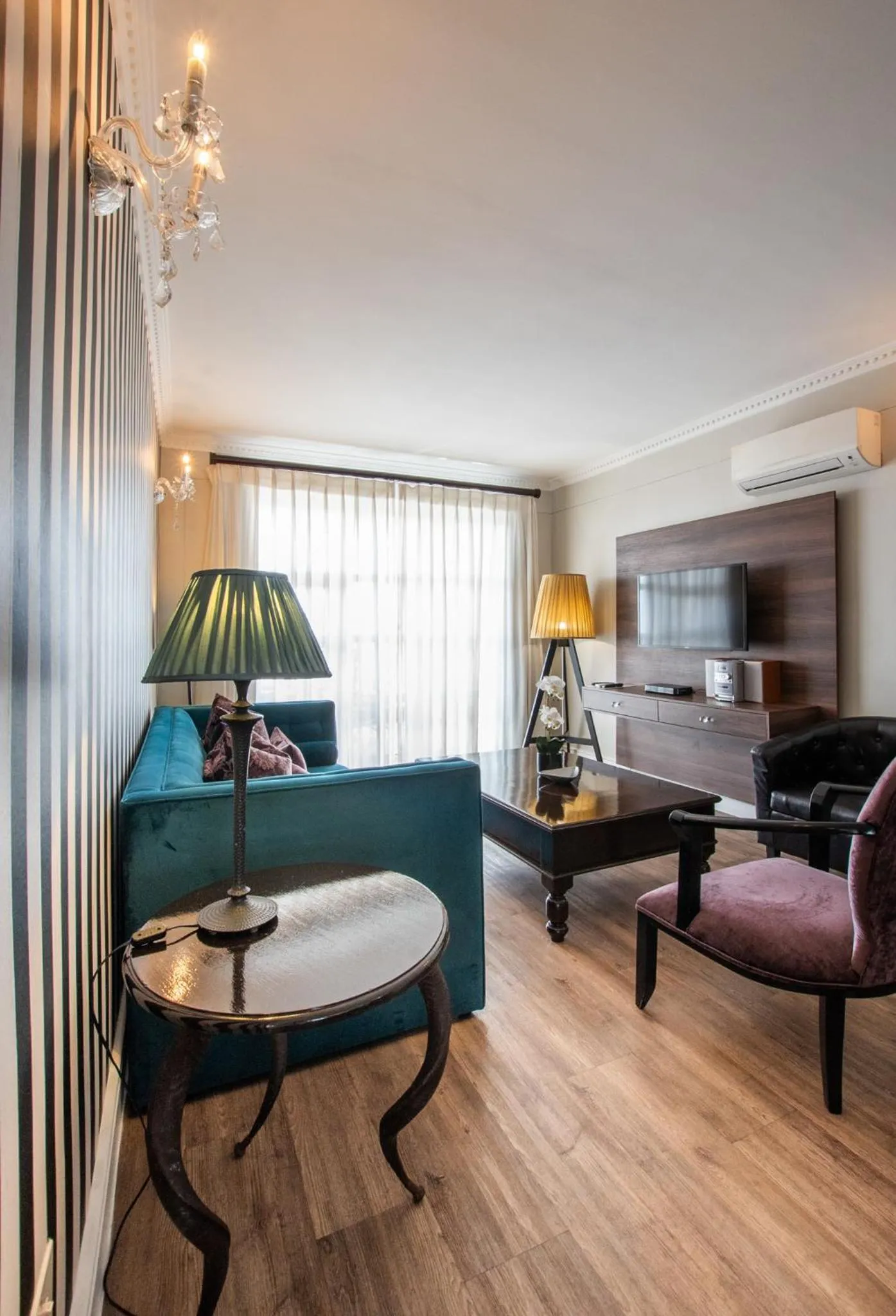 TV and multimedia in Romney Park Luxury Apartments by The Stay Collection