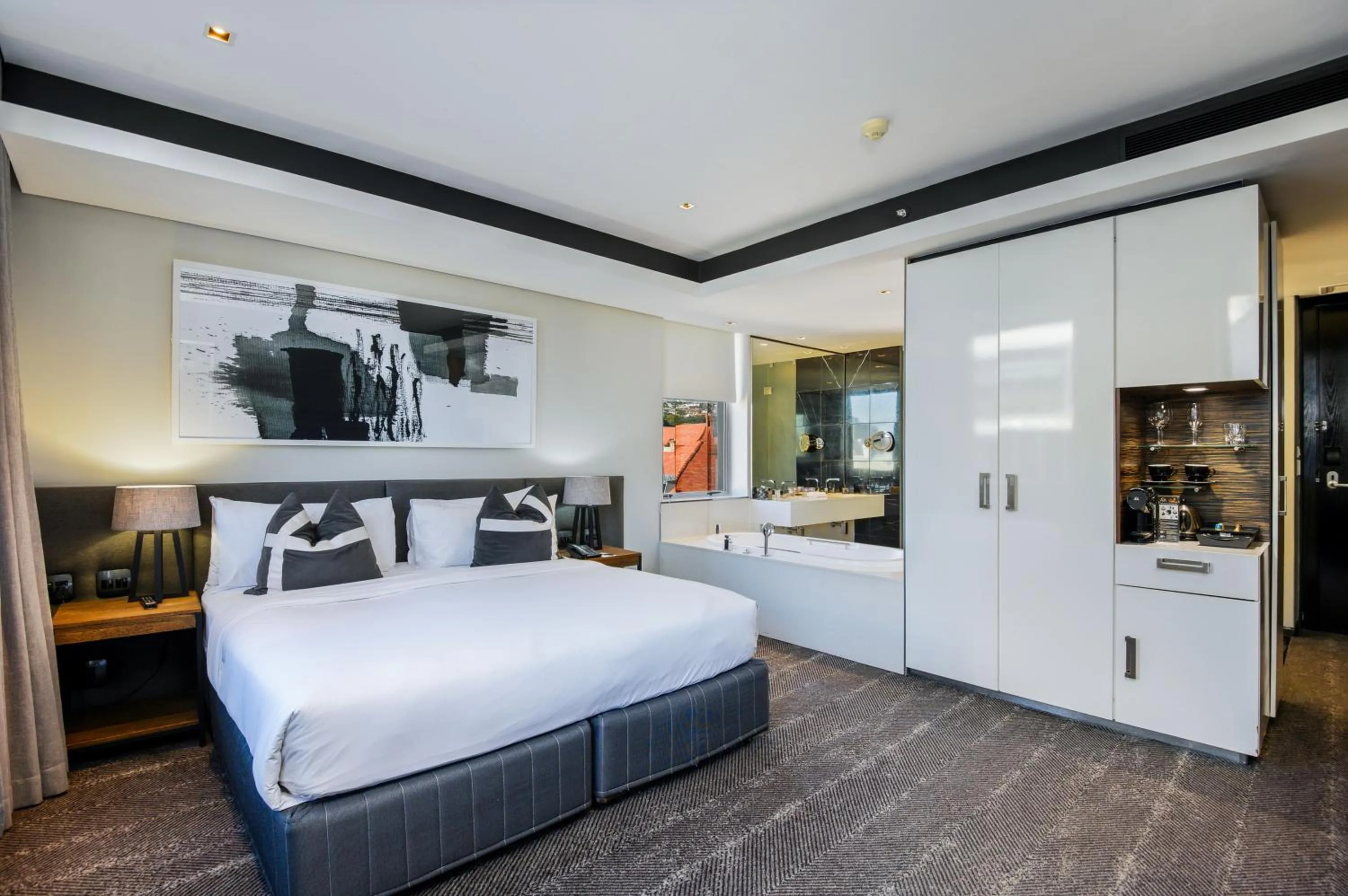 Kitchen or kitchenette, Bed in The Capital 15 on Orange Hotel & Spa