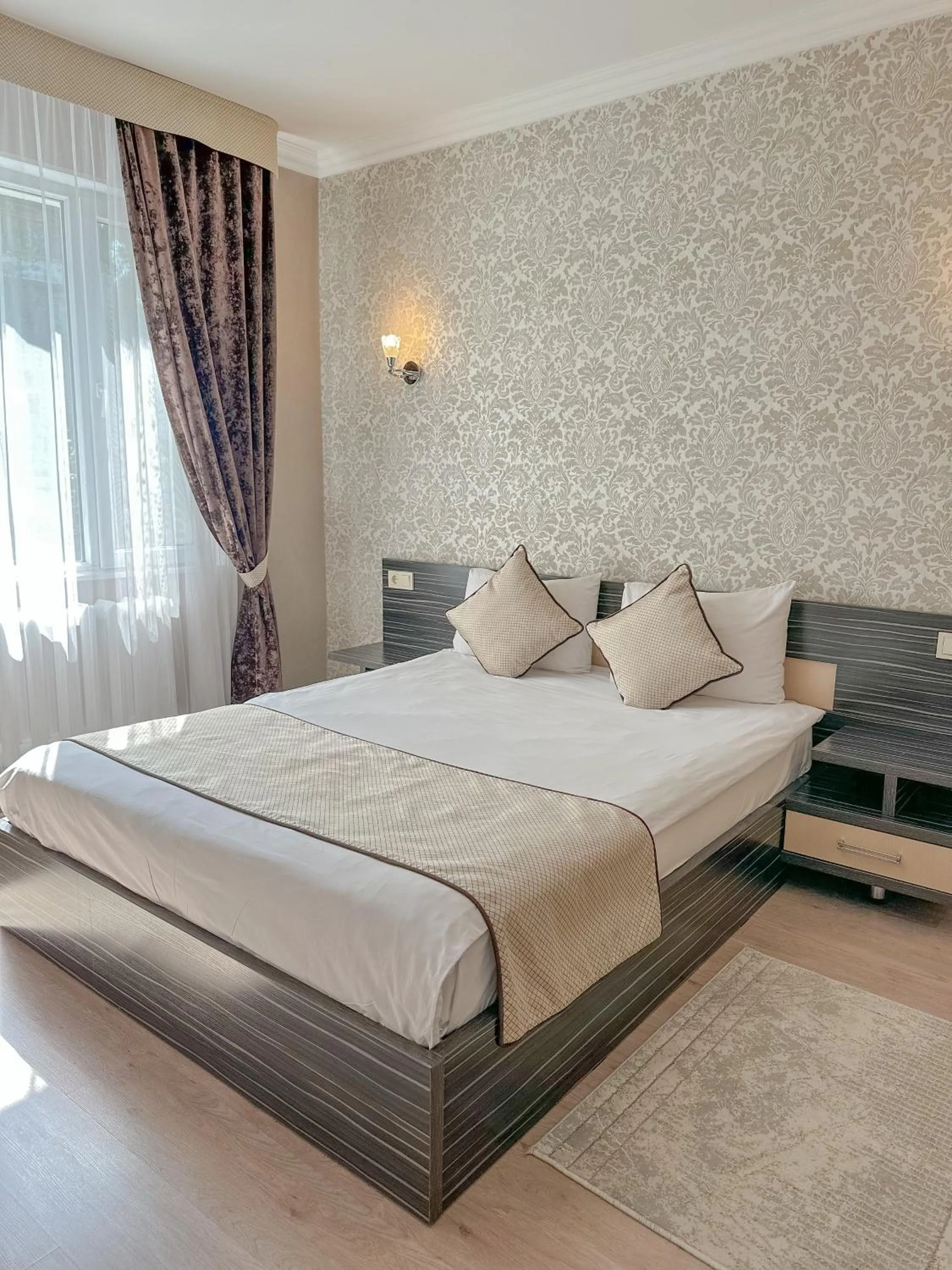 Living room, Bed in Resident Hotel Almaty