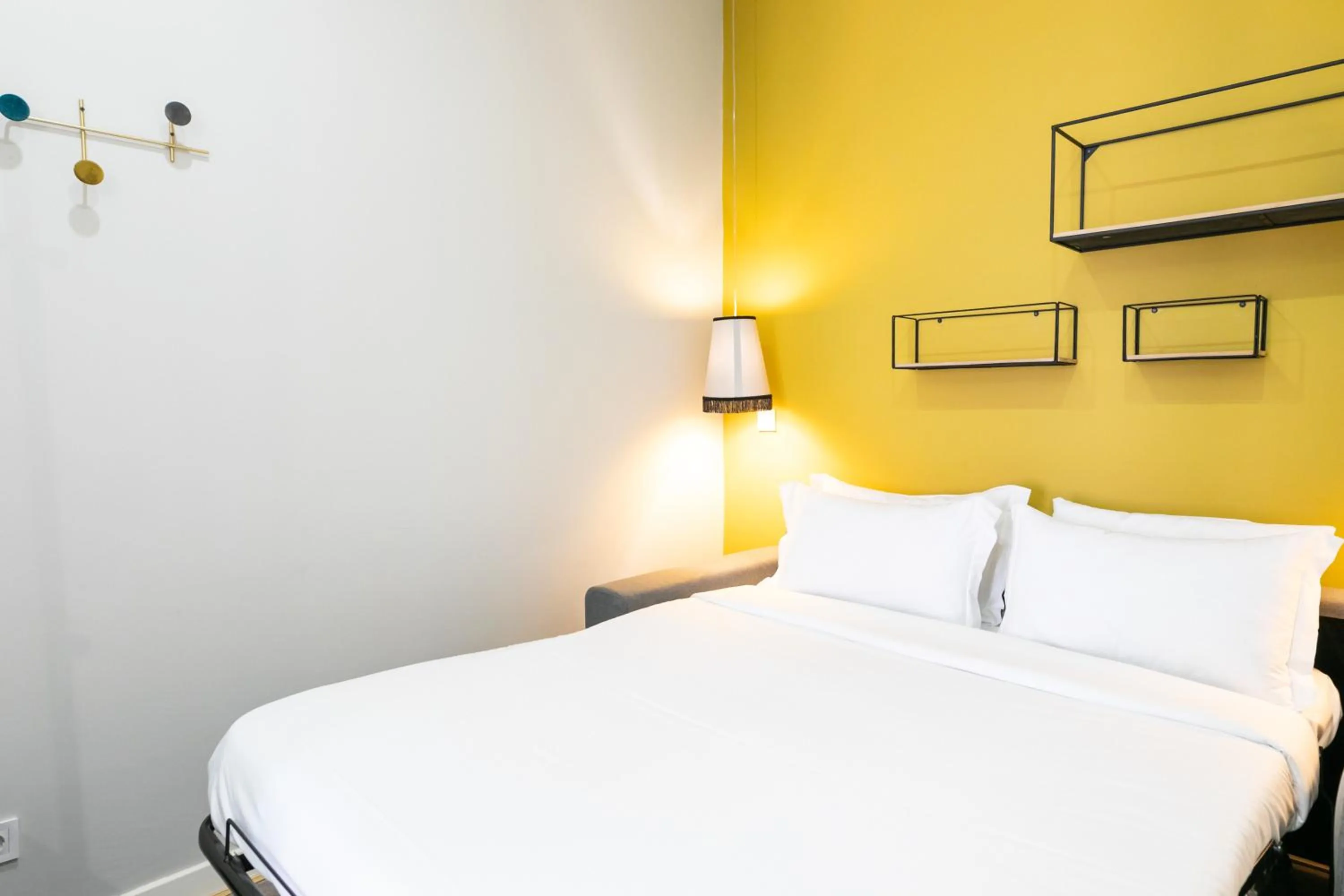 Bed in Lisboa 85 Suites & Apartments by RIDAN Hotels