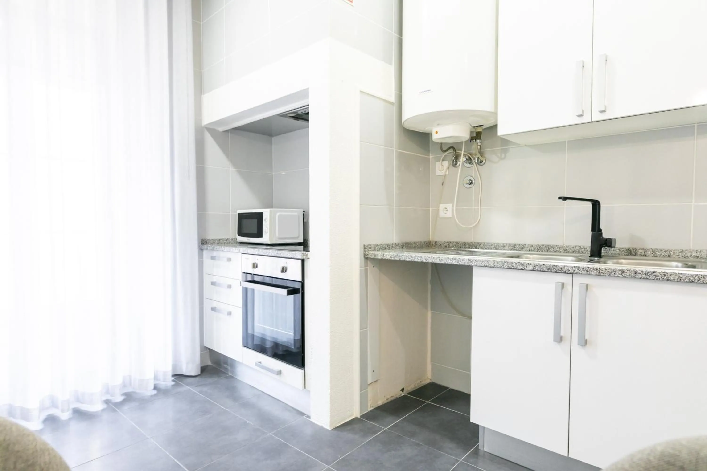 kitchen in Lisboa 85 Suites & Apartments by RIDAN Hotels