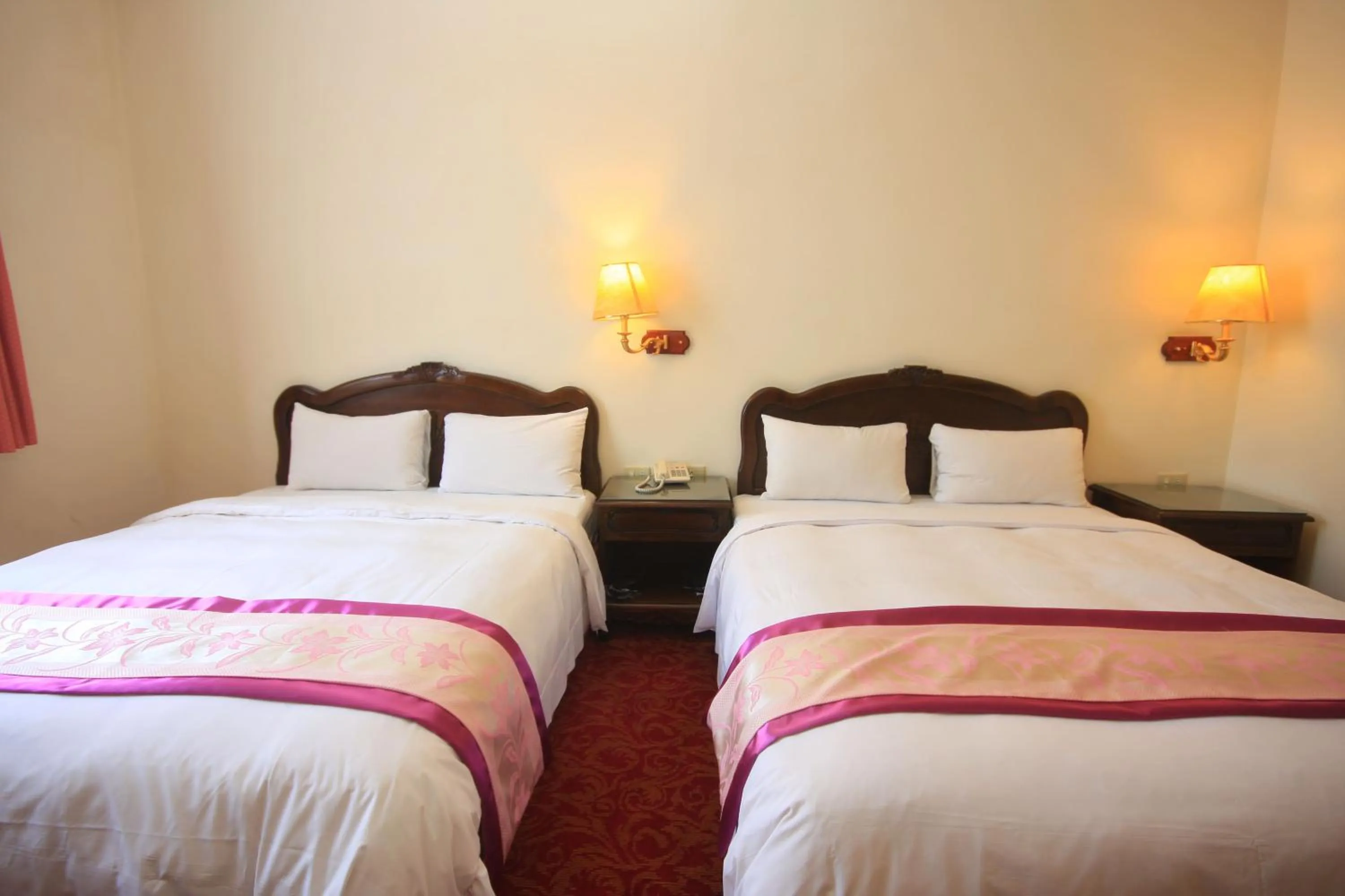 Bed in East Commercial Affairs Hotel