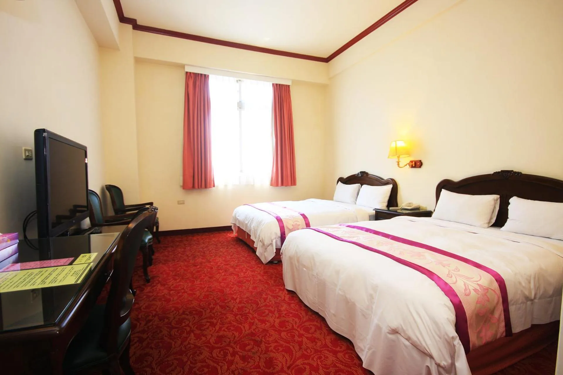 Bed in East Commercial Affairs Hotel