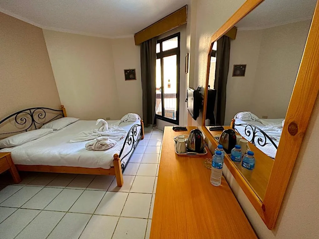 Bed in Gaddis Hotel, Suites and Apartments