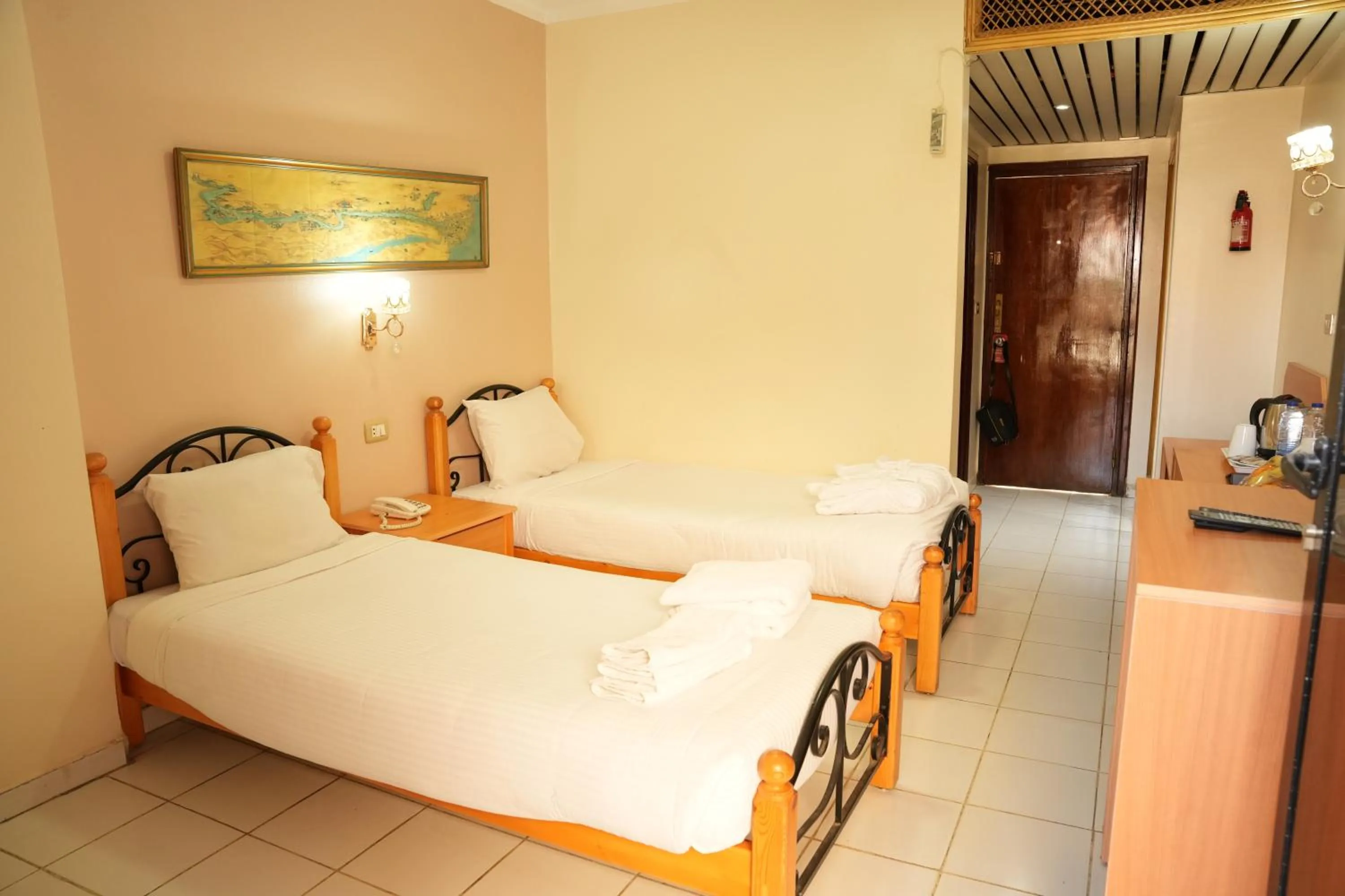 Bed in Gaddis Hotel, Suites and Apartments