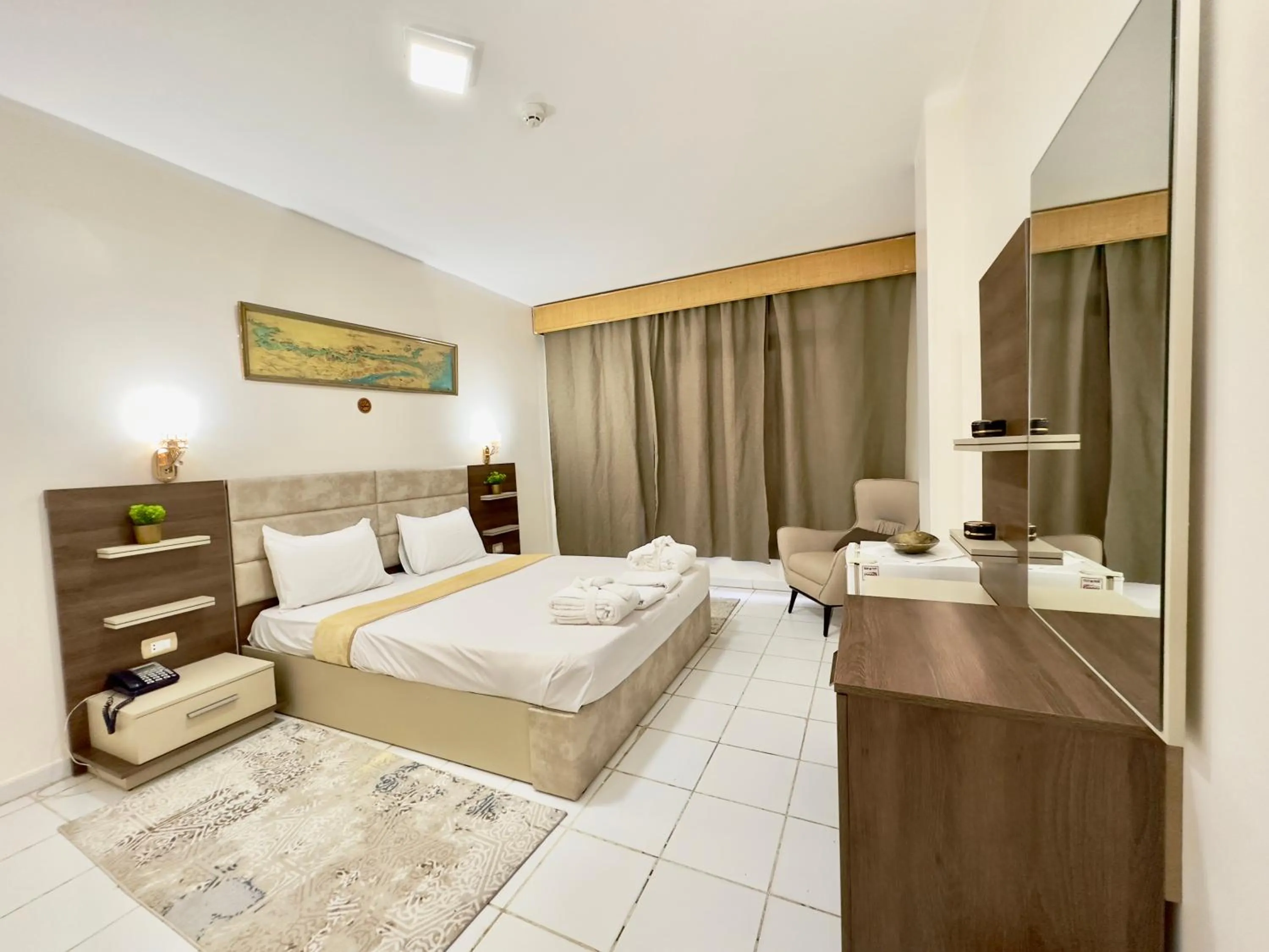 Bed in Gaddis Hotel, Suites and Apartments
