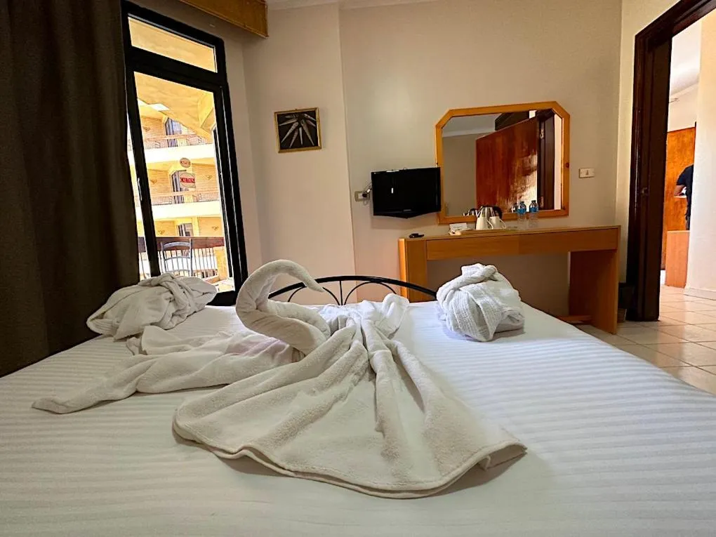 Bed in Gaddis Hotel, Suites and Apartments