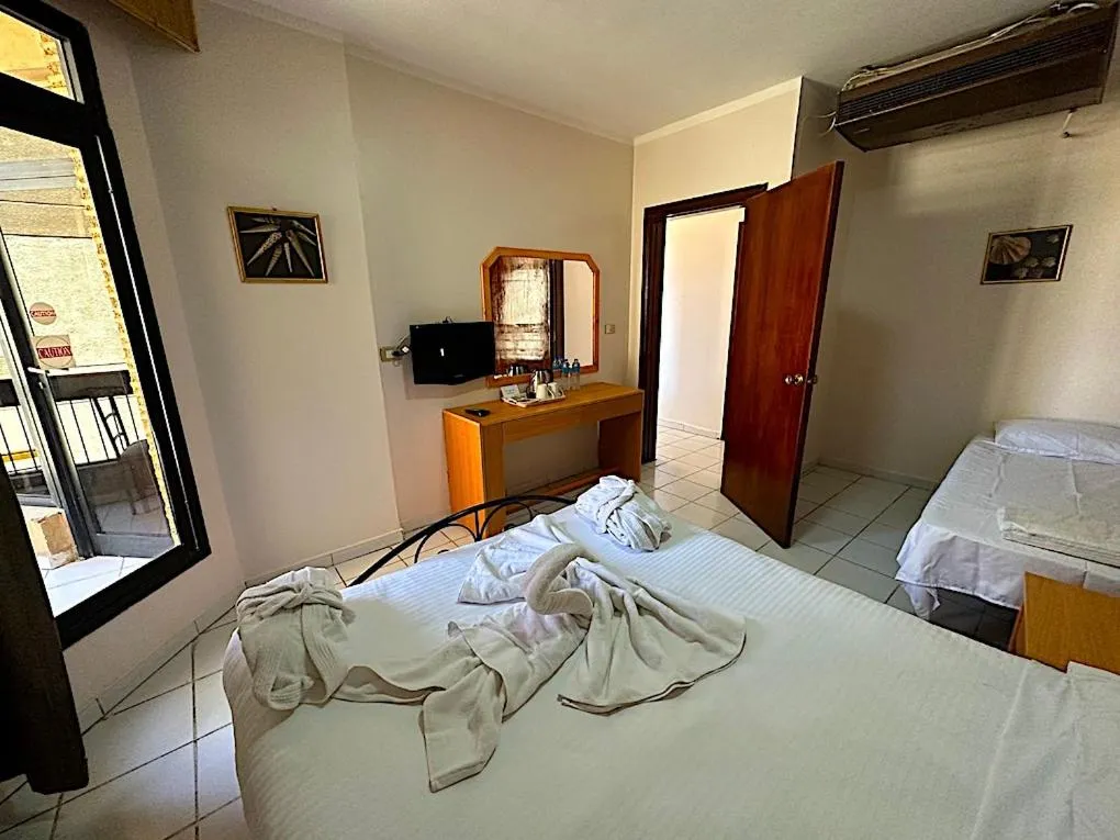 Bed in Gaddis Hotel, Suites and Apartments