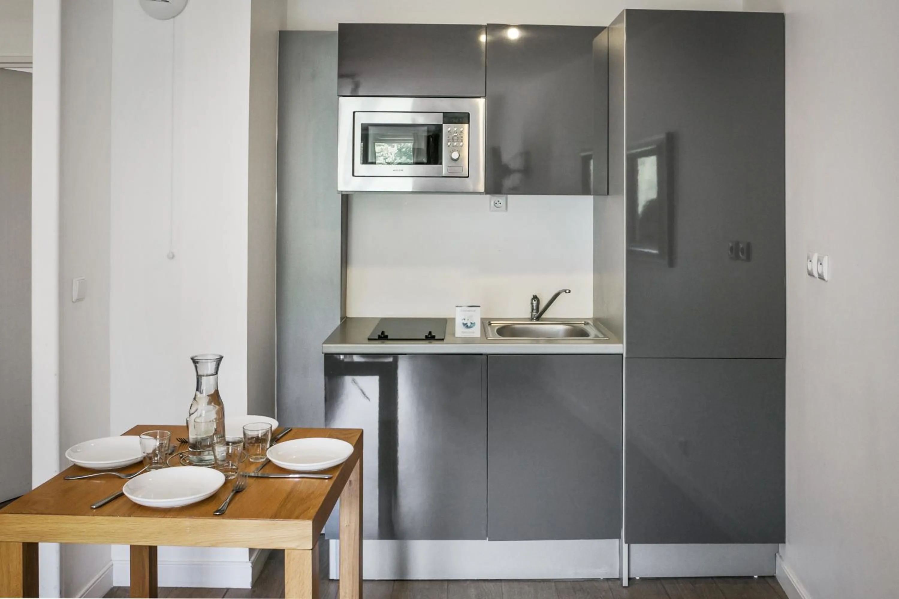 Kitchen or kitchenette in Comfort Aparthotel Lourdes Lorda