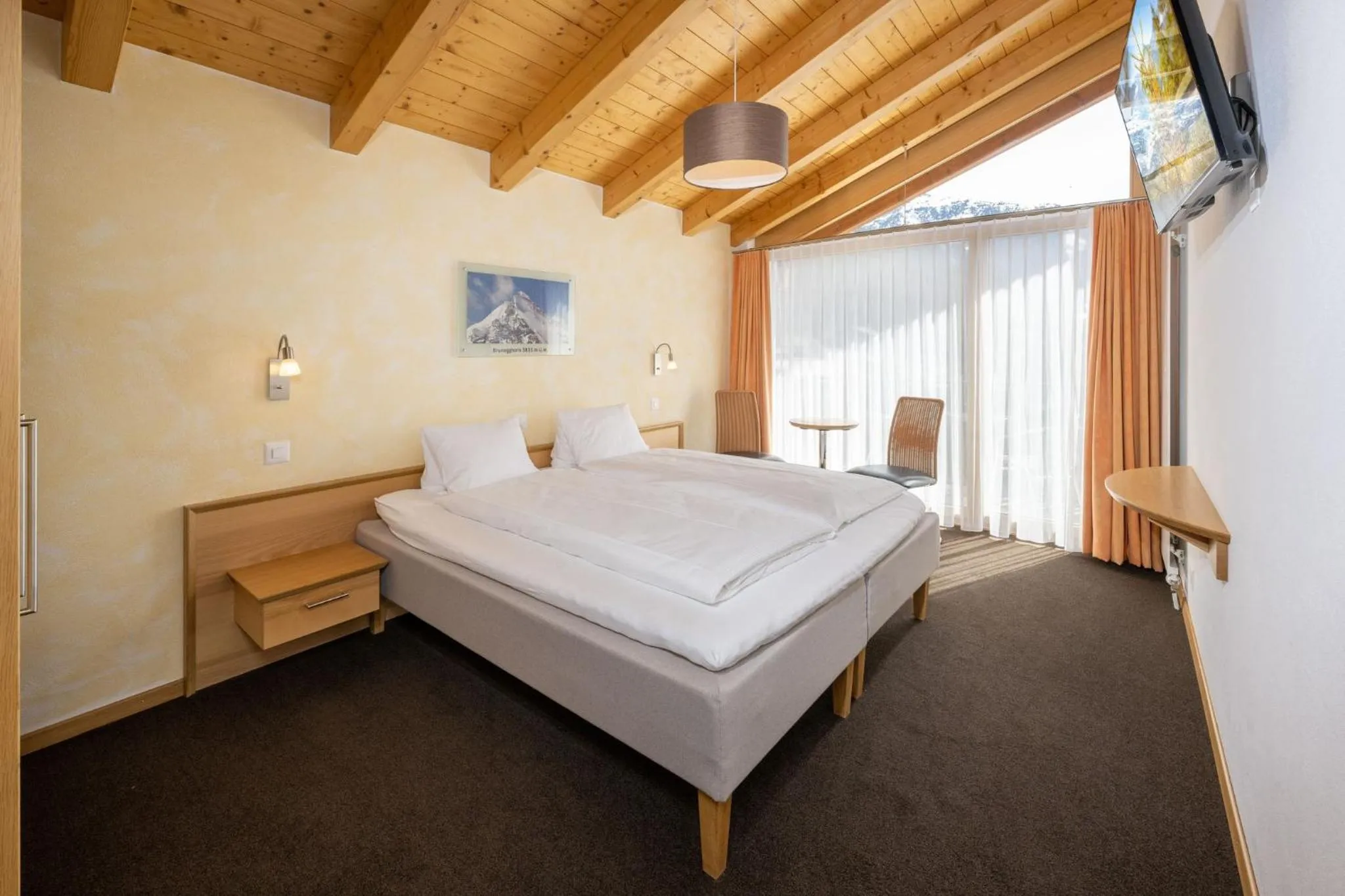 Photo of the whole room, Bed in Aktiv Hotel & Spa Hannigalp