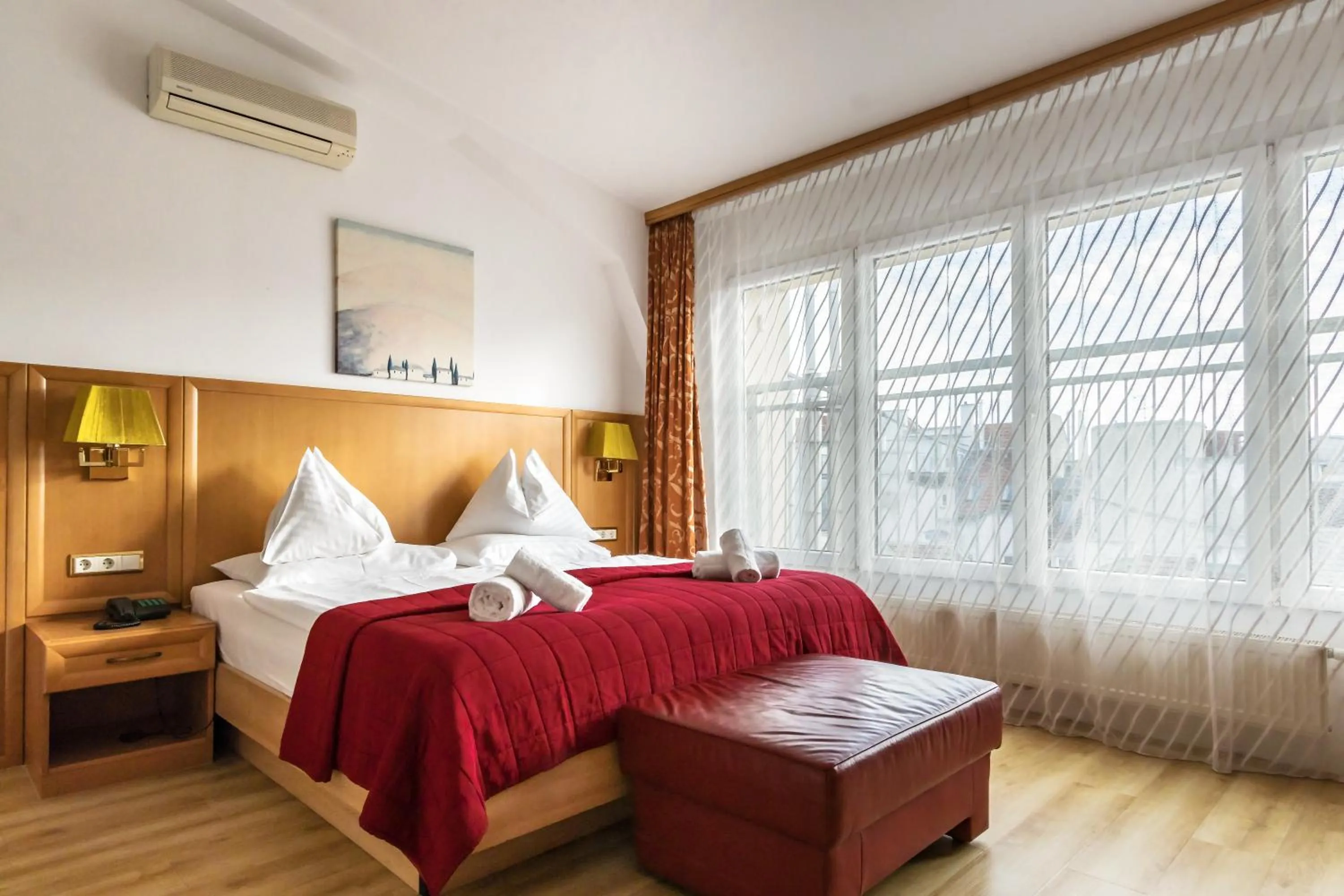 Bed in Hotel Corvinus Vienna