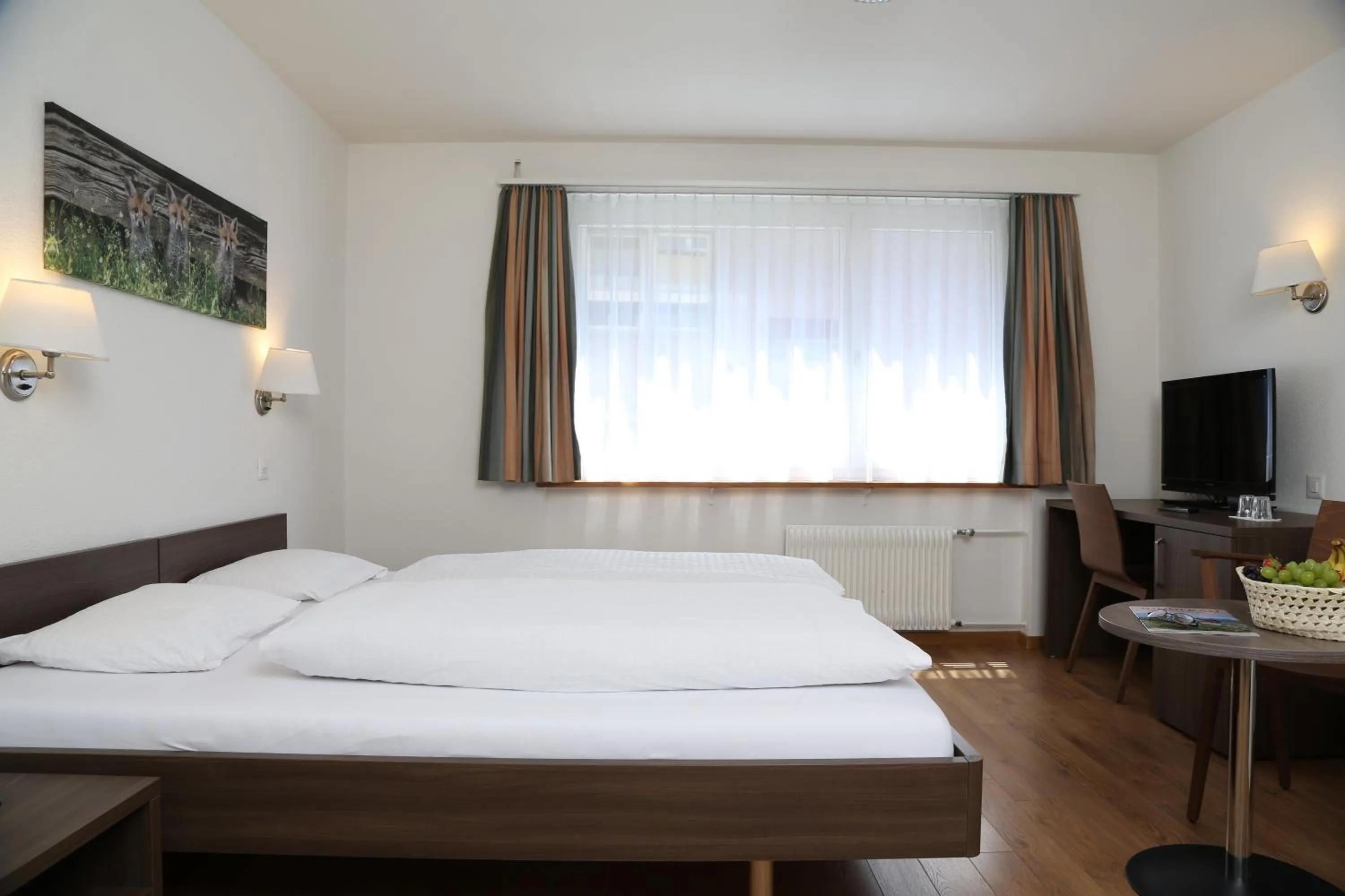 Photo of the whole room, Bed in Hotel Crystal Interlaken