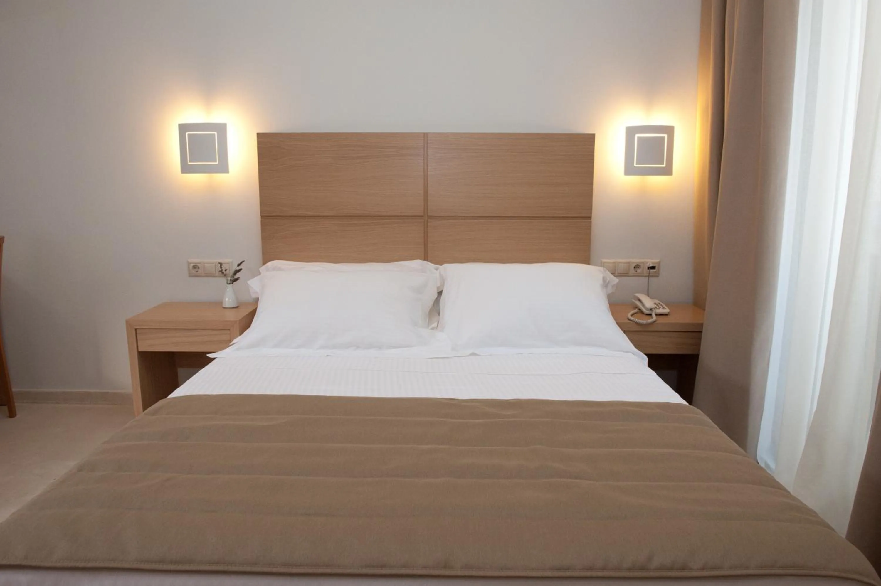 Bed in Aphrodite Samos Suites