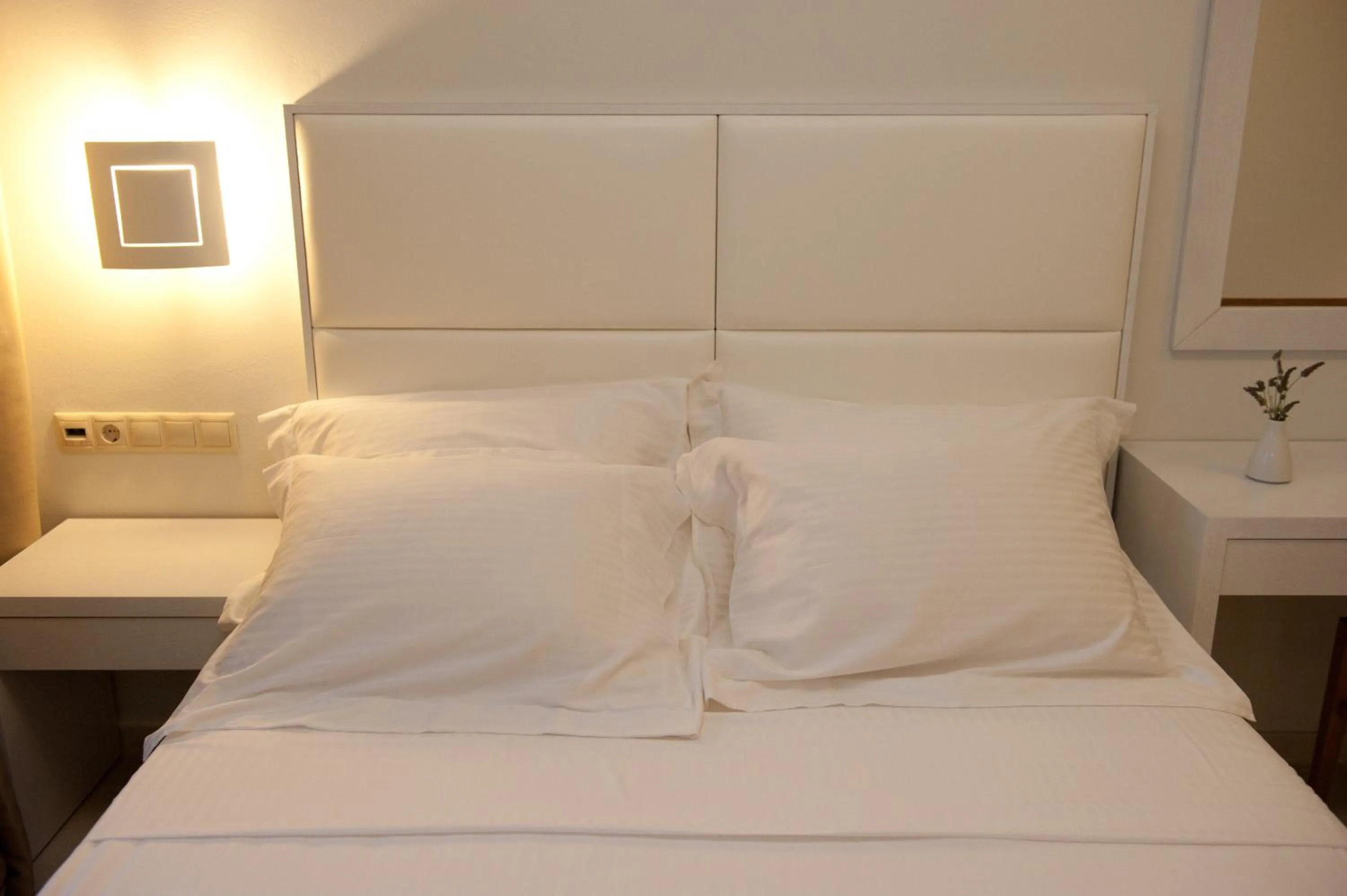 Bed in Aphrodite Samos Suites