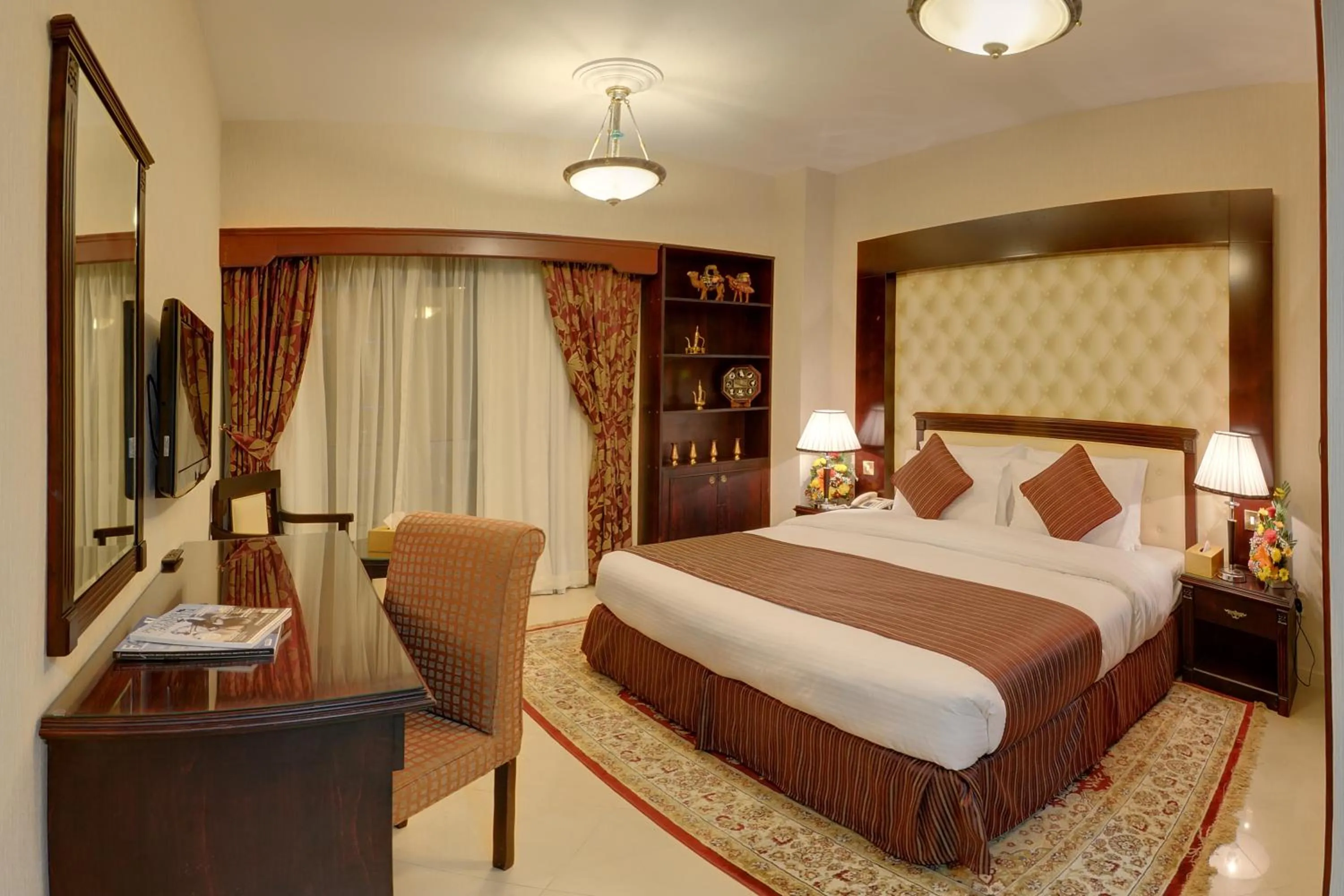 Bed in Deira Suites Deluxe Hotel Suites