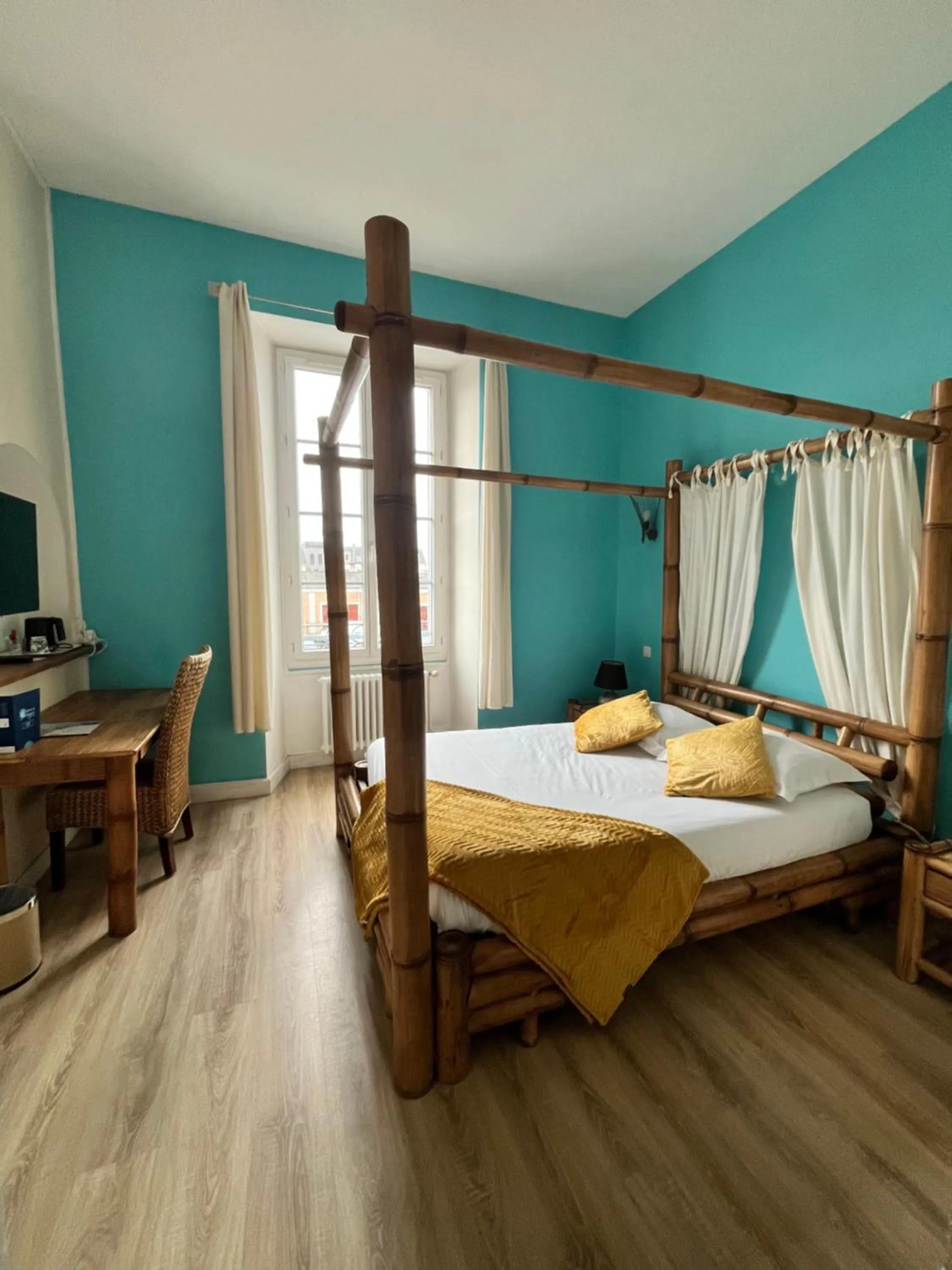 Photo of the whole room, Bed in Hôtel de Bretagne