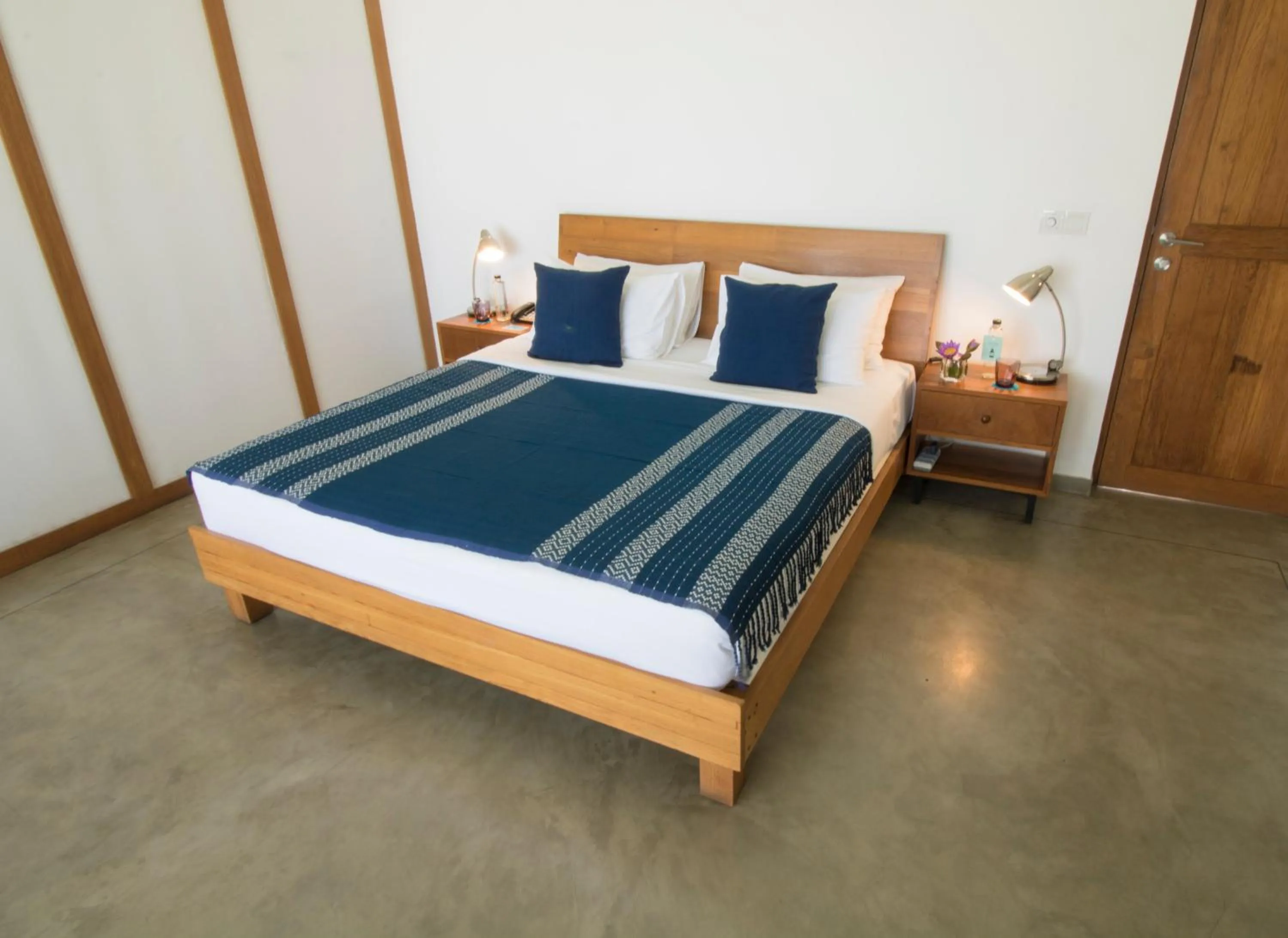 Bed in Ubuntu Beach Villas by Reveal