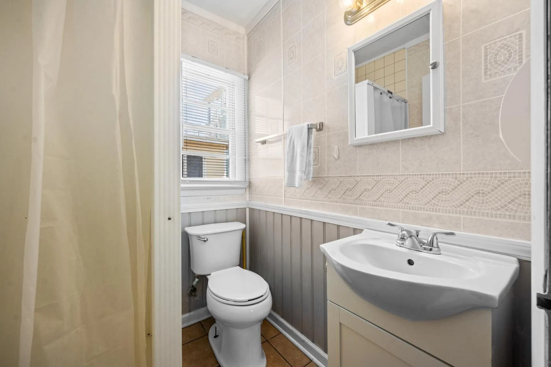 Bathroom in Oceanside Court by KEES Vacations