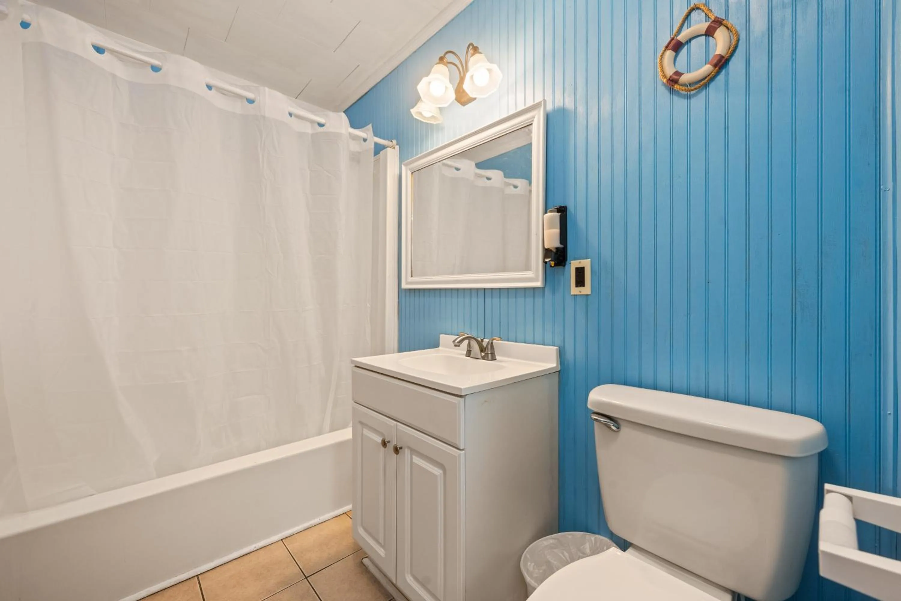 Bathroom in Oceanside Court by KEES Vacations