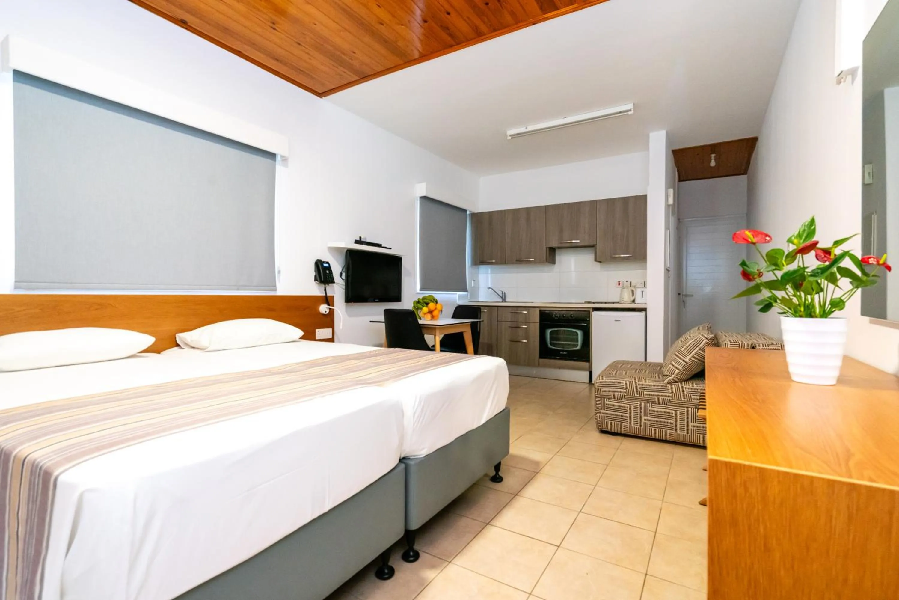 Bed in Helios Bay Hotel and Suites