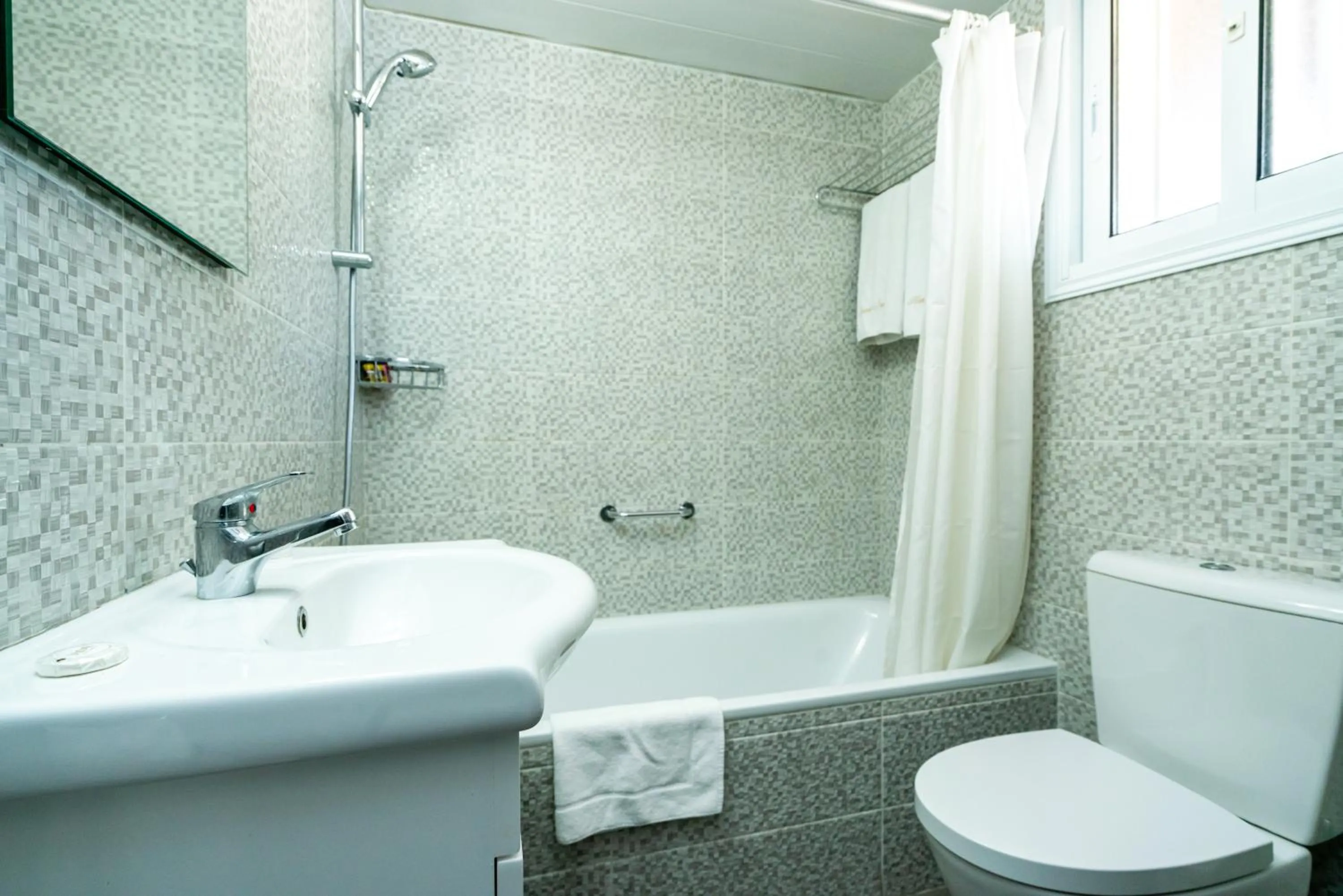 Bathroom in Helios Bay Hotel and Suites