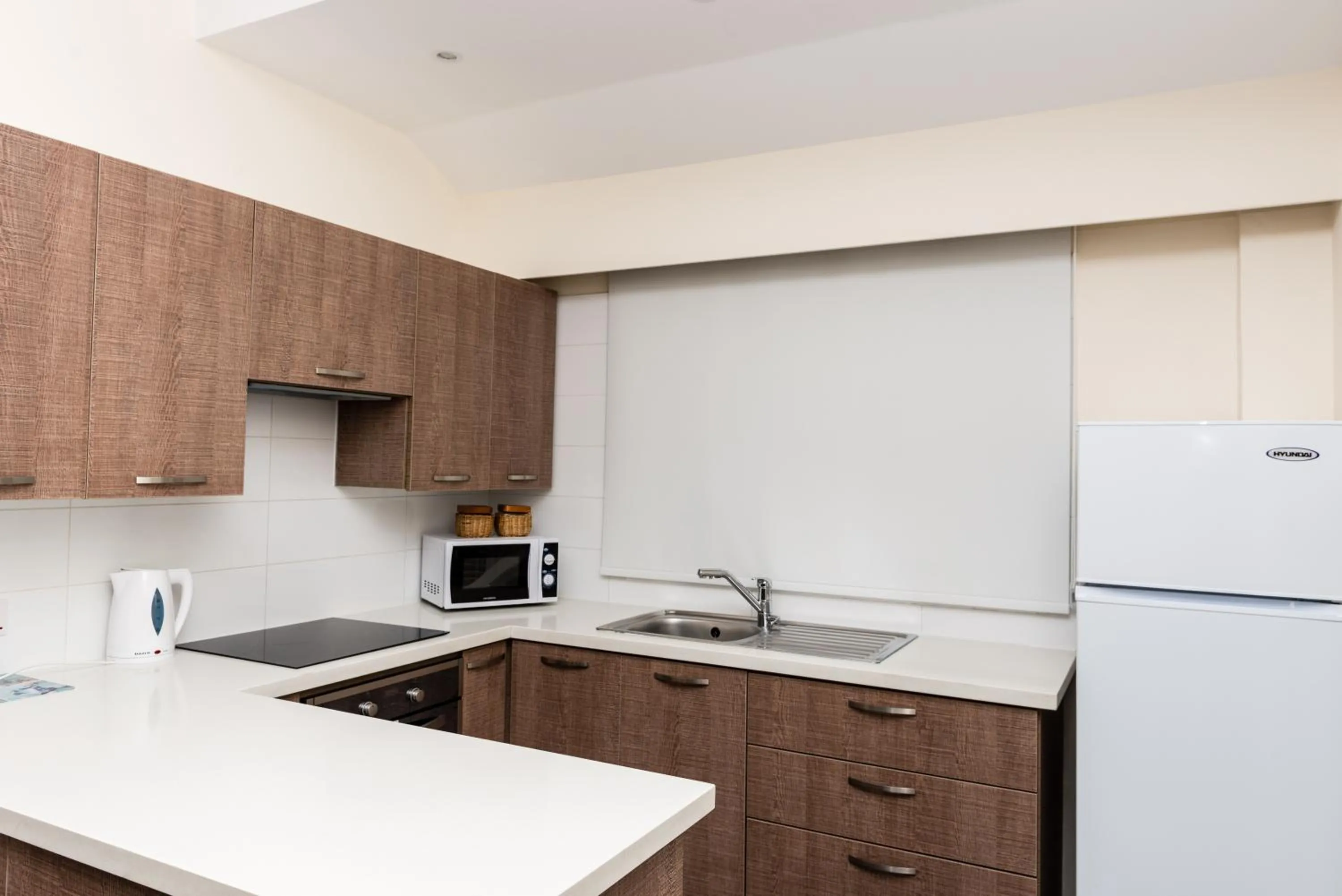 Kitchen or kitchenette in Helios Bay Hotel and Suites