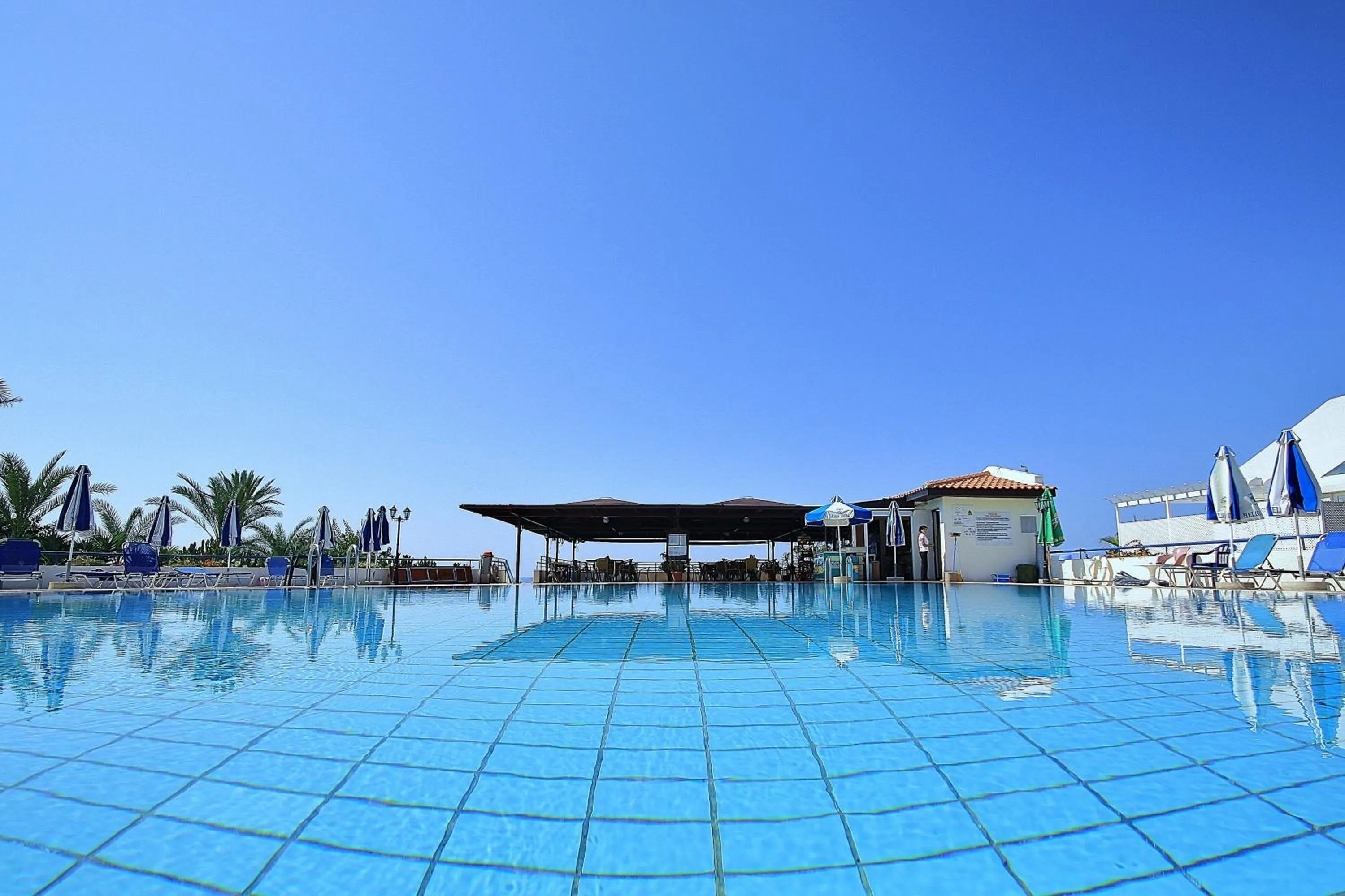 Swimming pool in Helios Bay Hotel and Suites