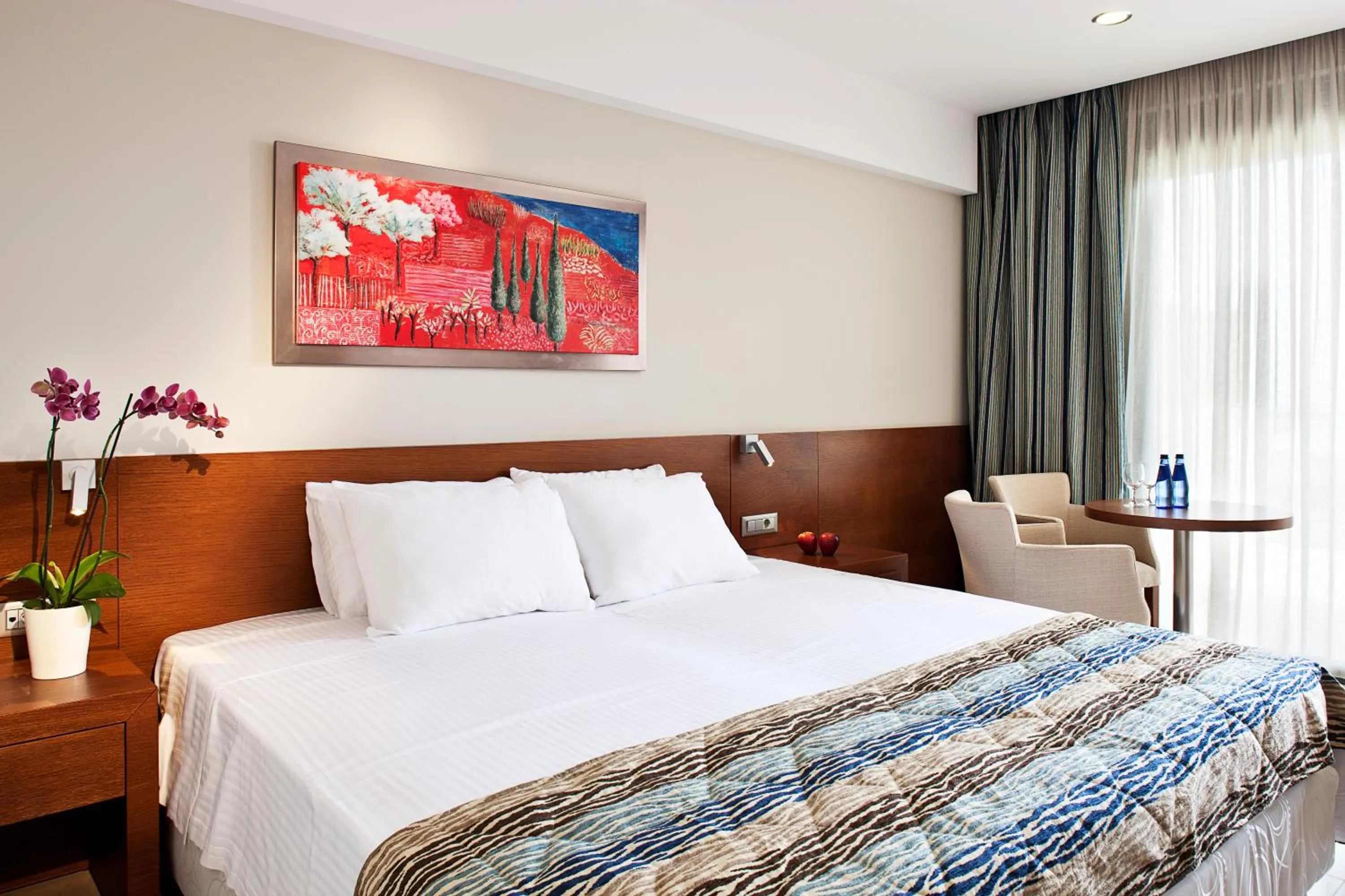 Bed in Apollonion Asterias Resort and Spa