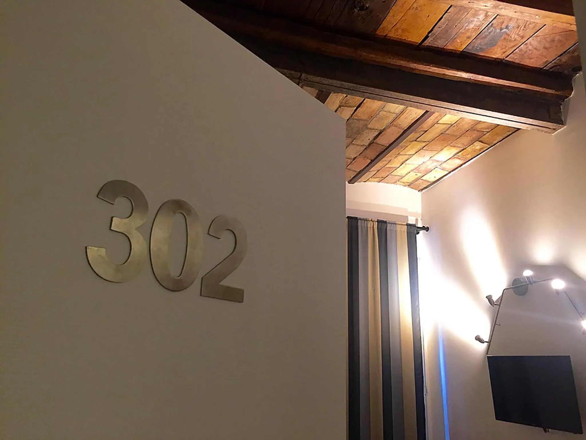 TV and multimedia in Giuturna Boutique Hotel