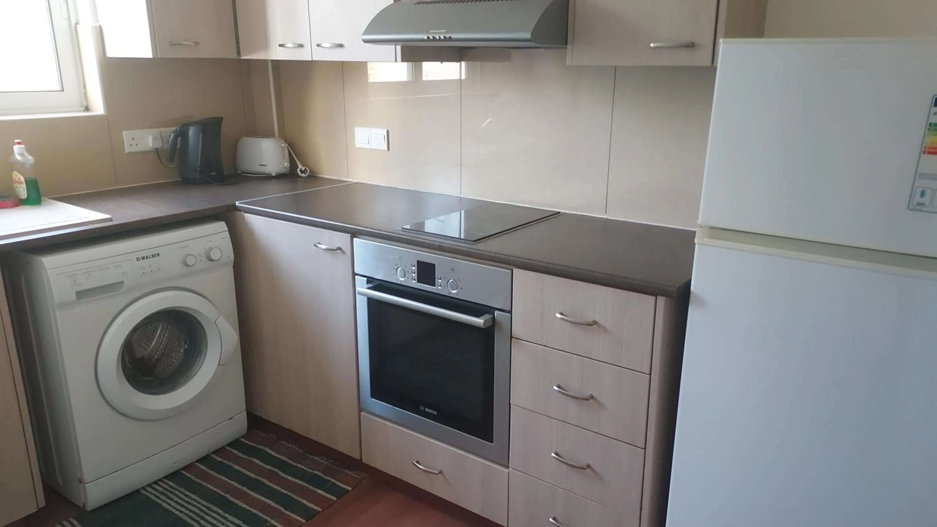 Kitchen or kitchenette in Sea Apartments