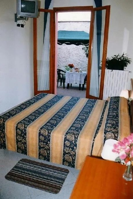 Bed in Hotel Greco