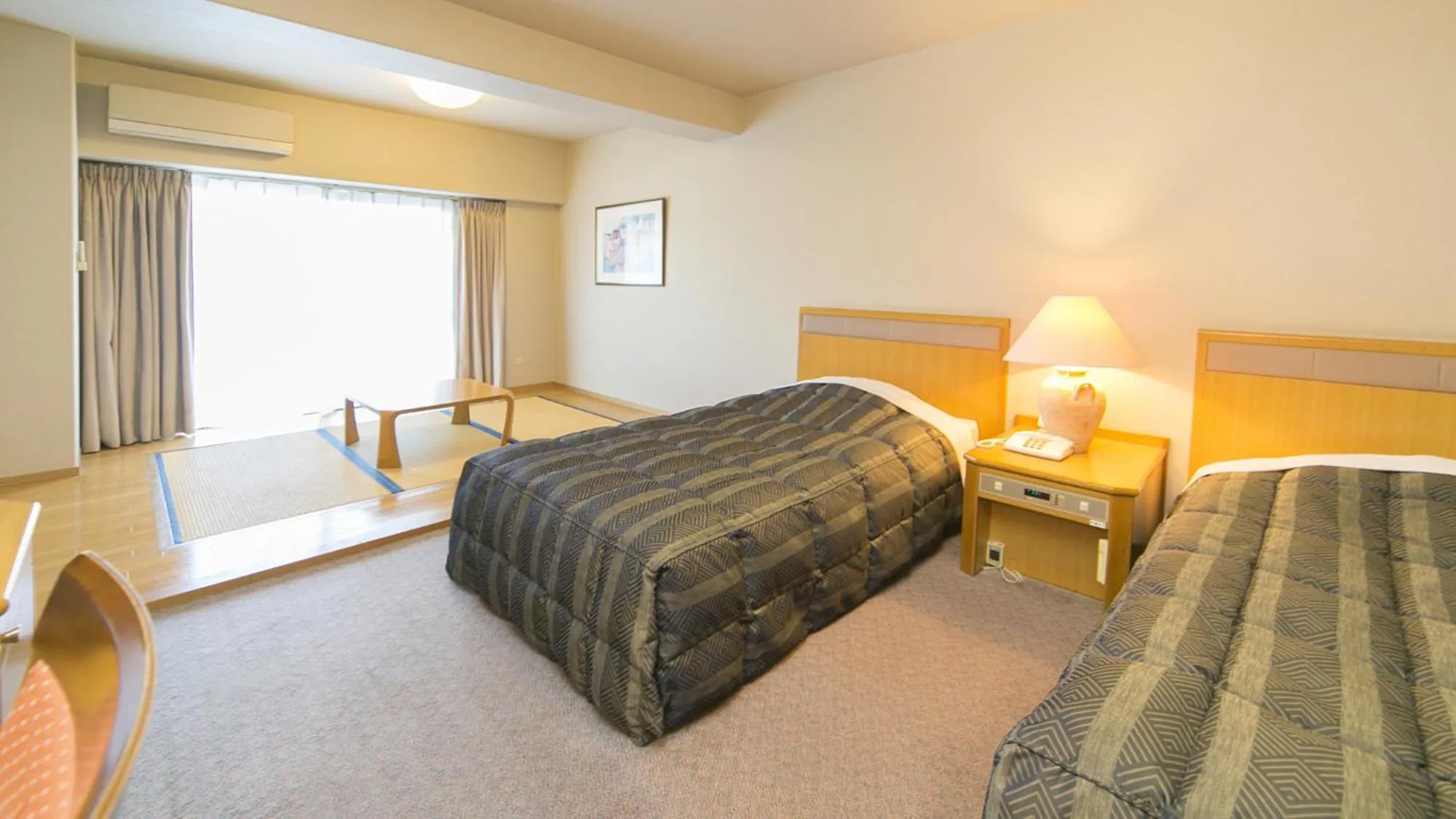 Bed in Hyper Resort Villa Shionoe