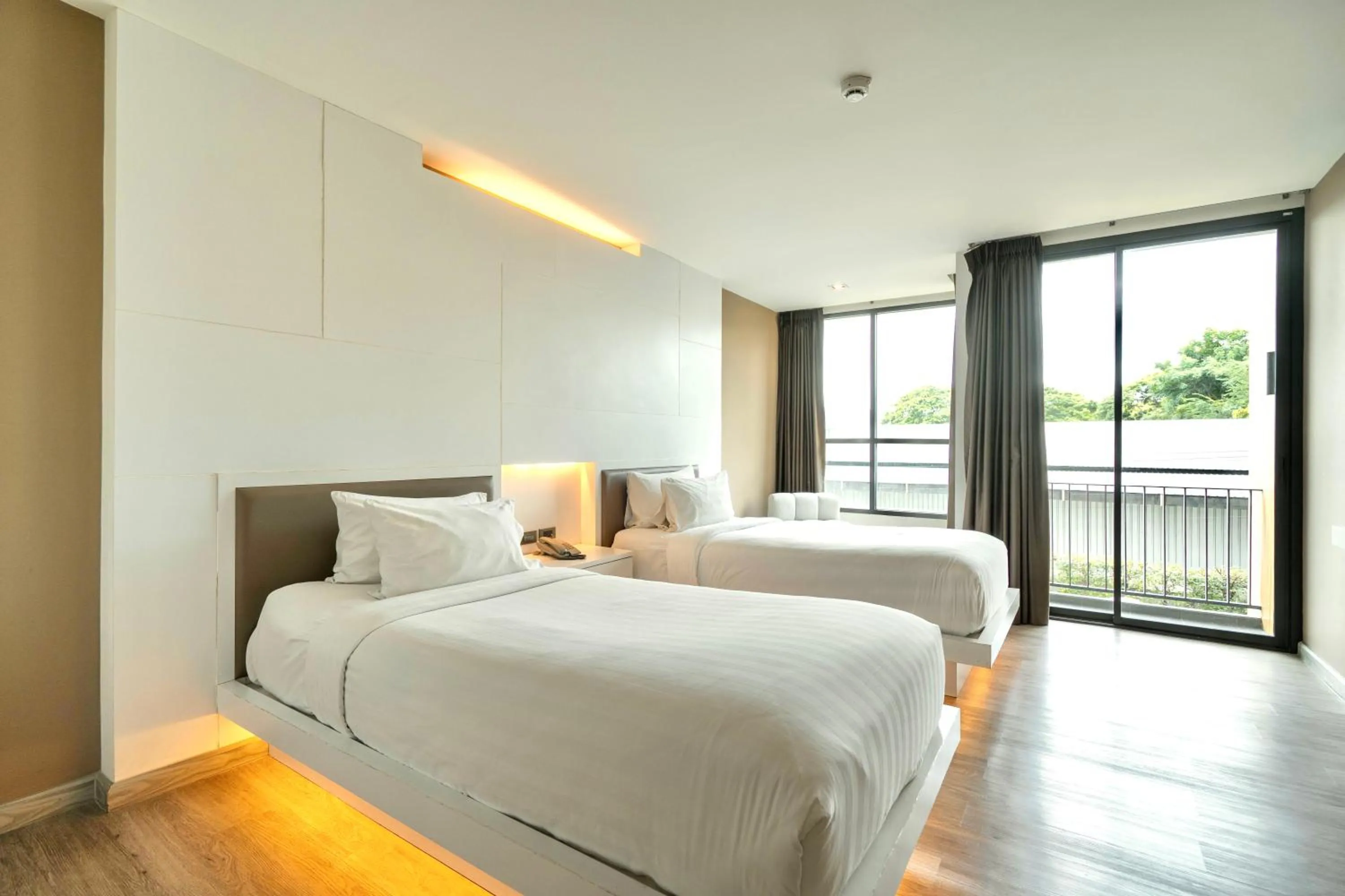 Bed in The Zense Boutique Hotel