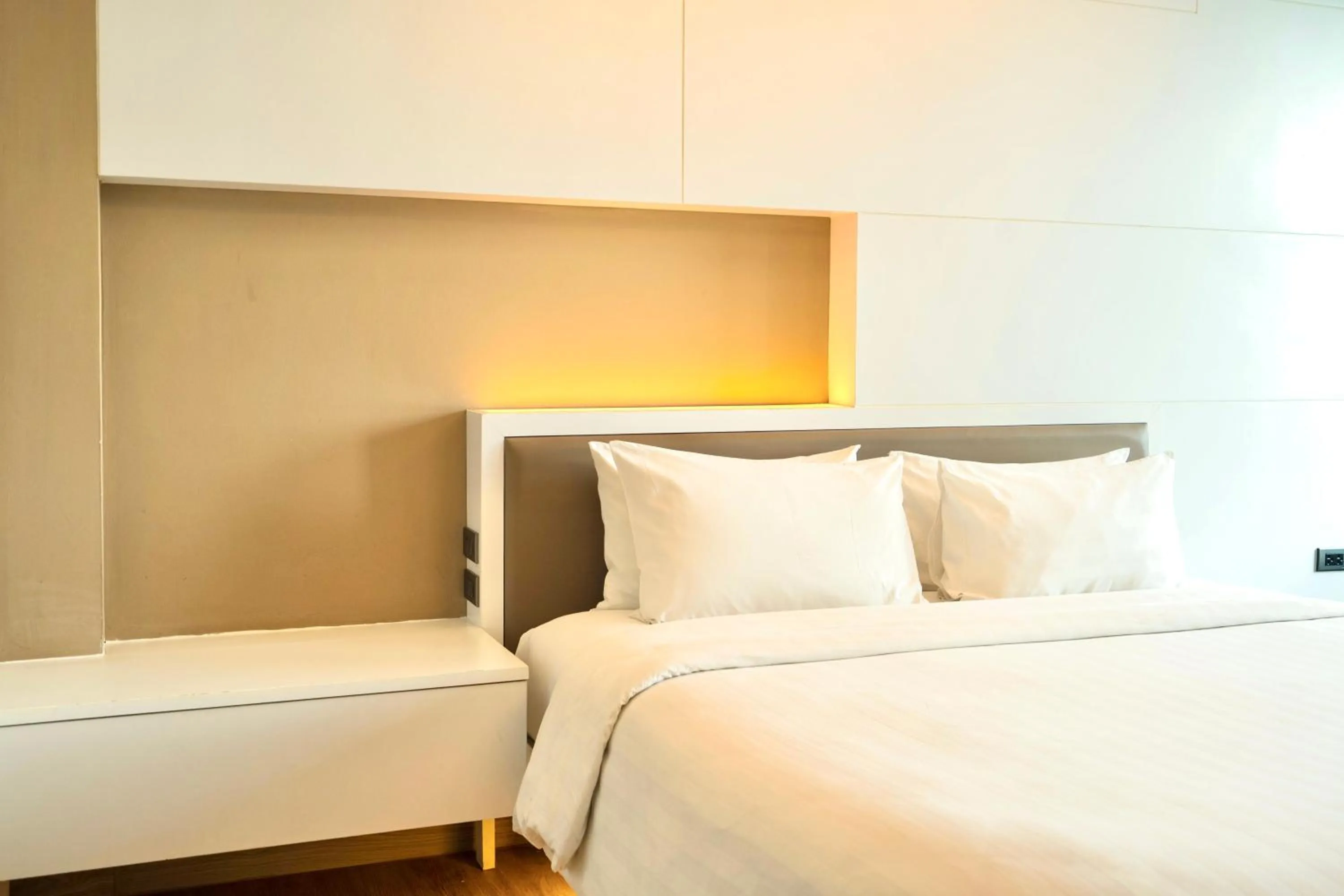 Bed in The Zense Boutique Hotel