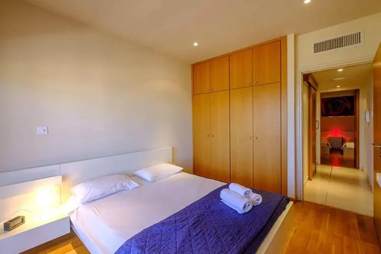 Bed in Les Palmiers Beach Boutique Hotel & Luxury Apartments