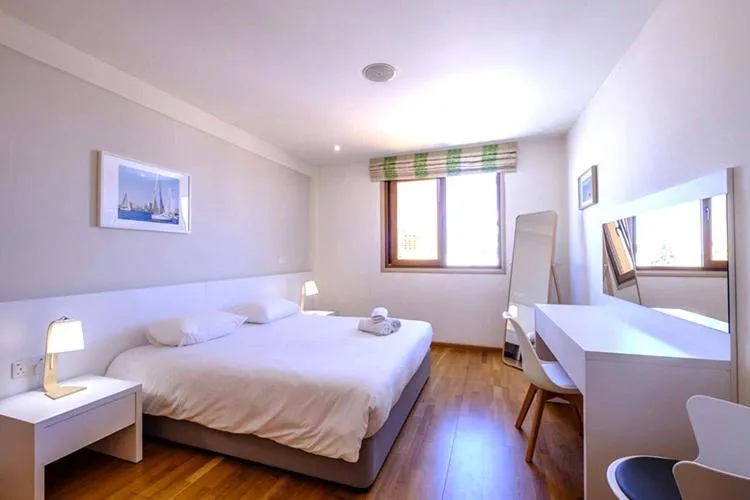 Bed in Les Palmiers Beach Boutique Hotel & Luxury Apartments