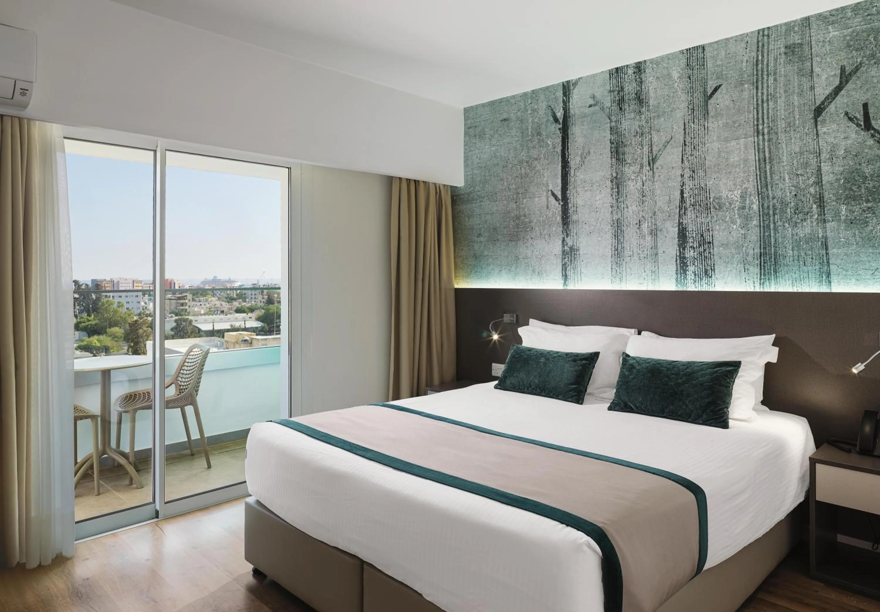 Bed in Pefkos City Hotel