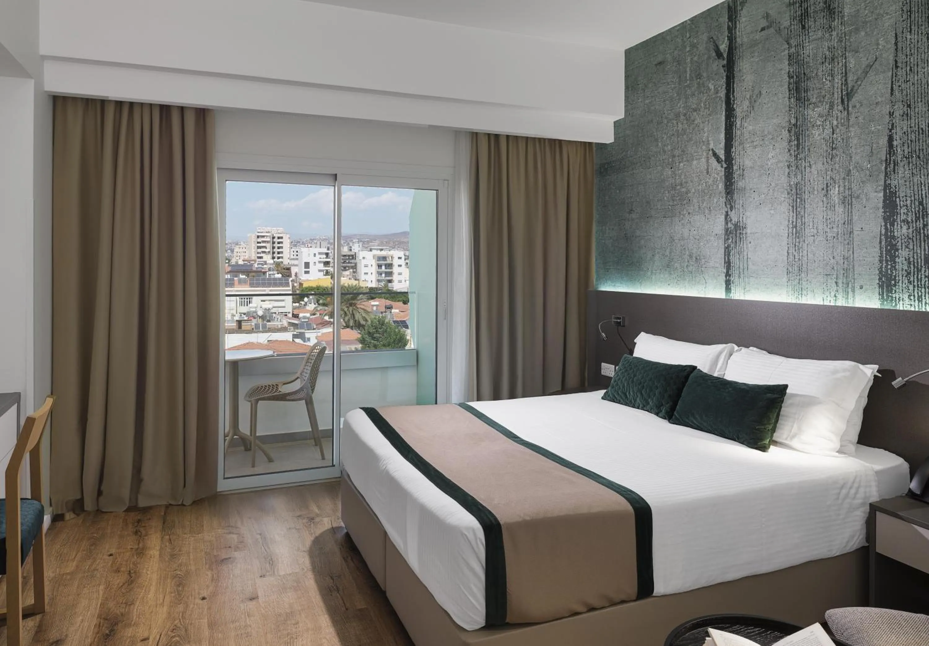 Bed in Pefkos City Hotel