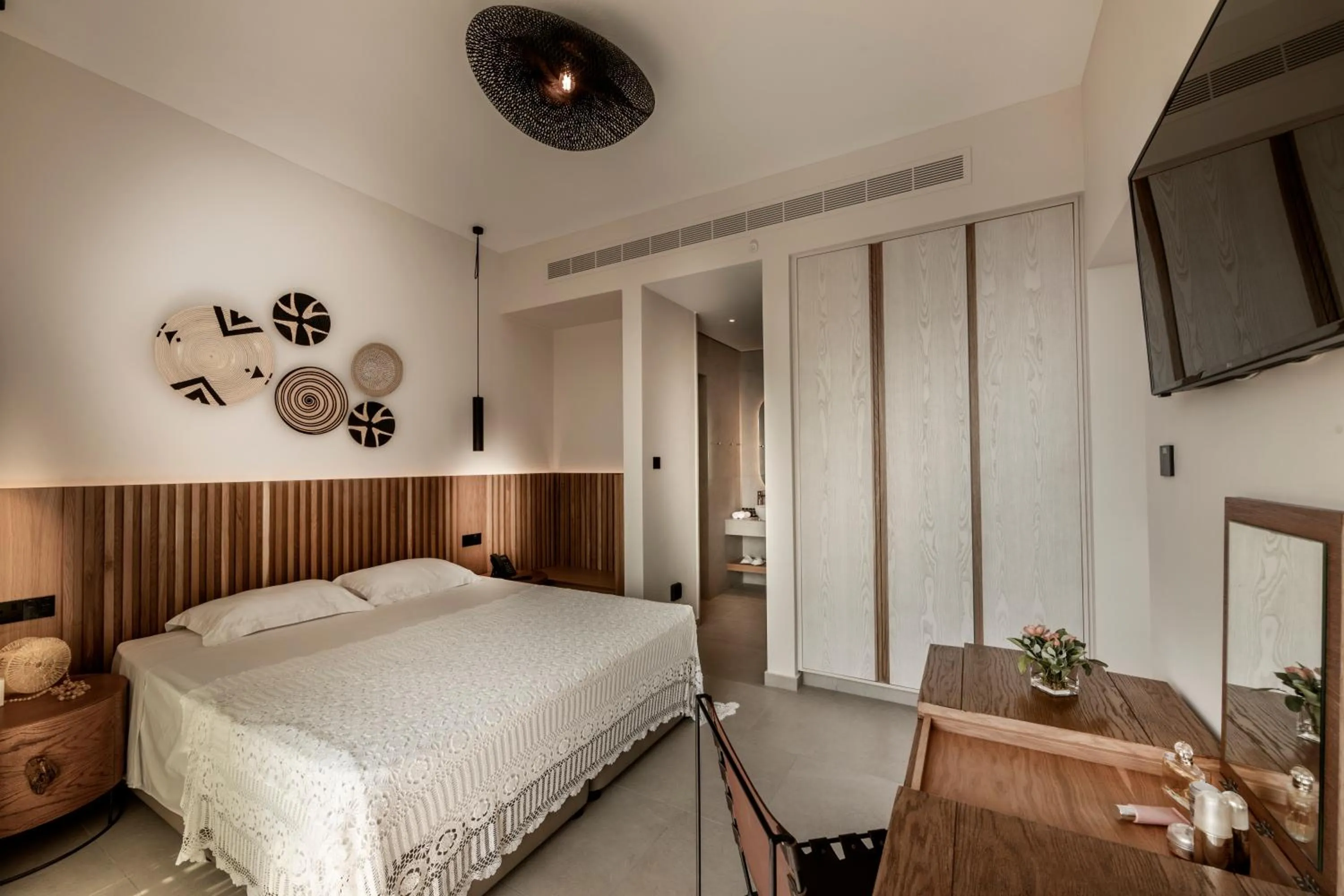 Bed in Anemi Hotel & Suites