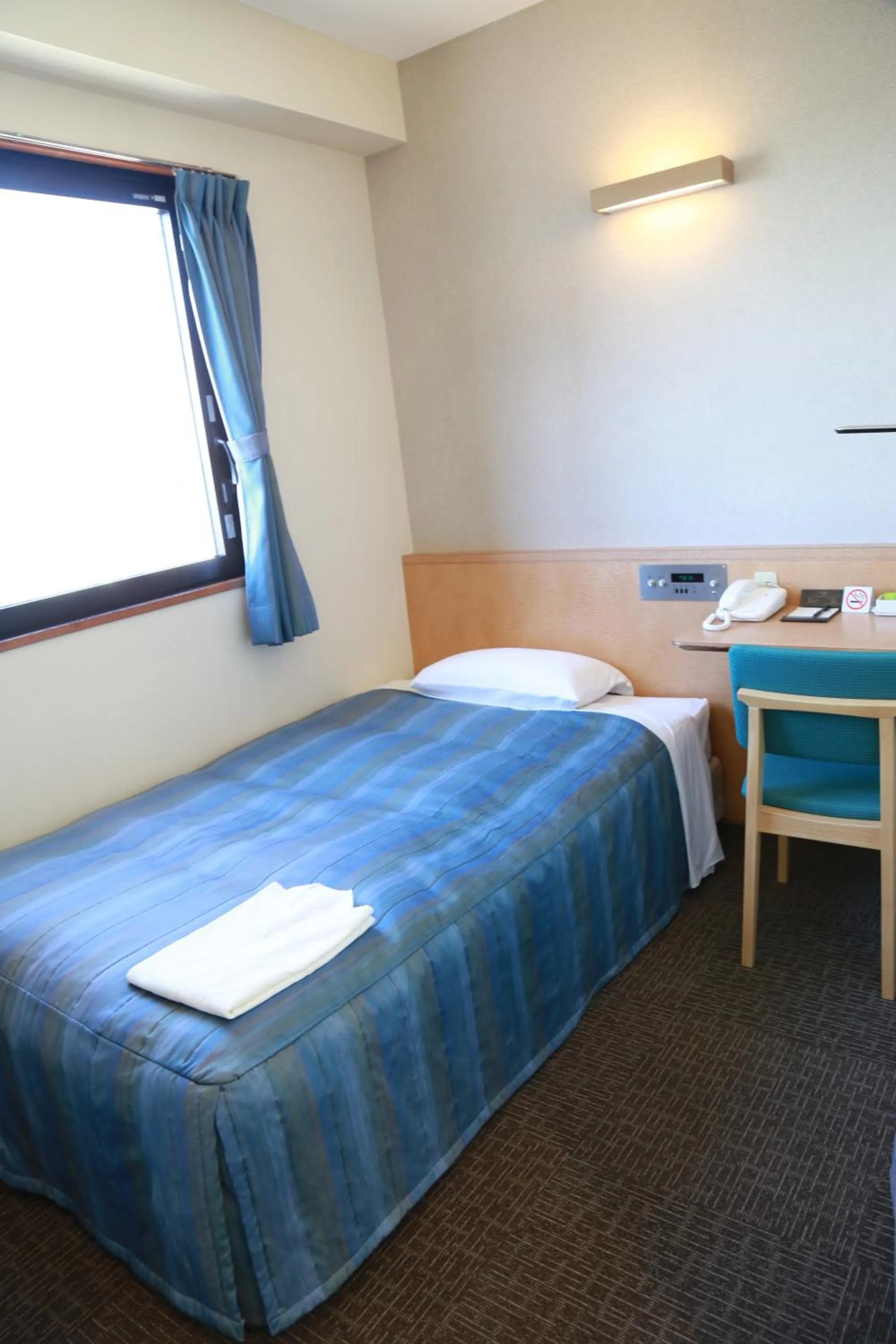 Bed in Hotel Plaza Arakawaoki