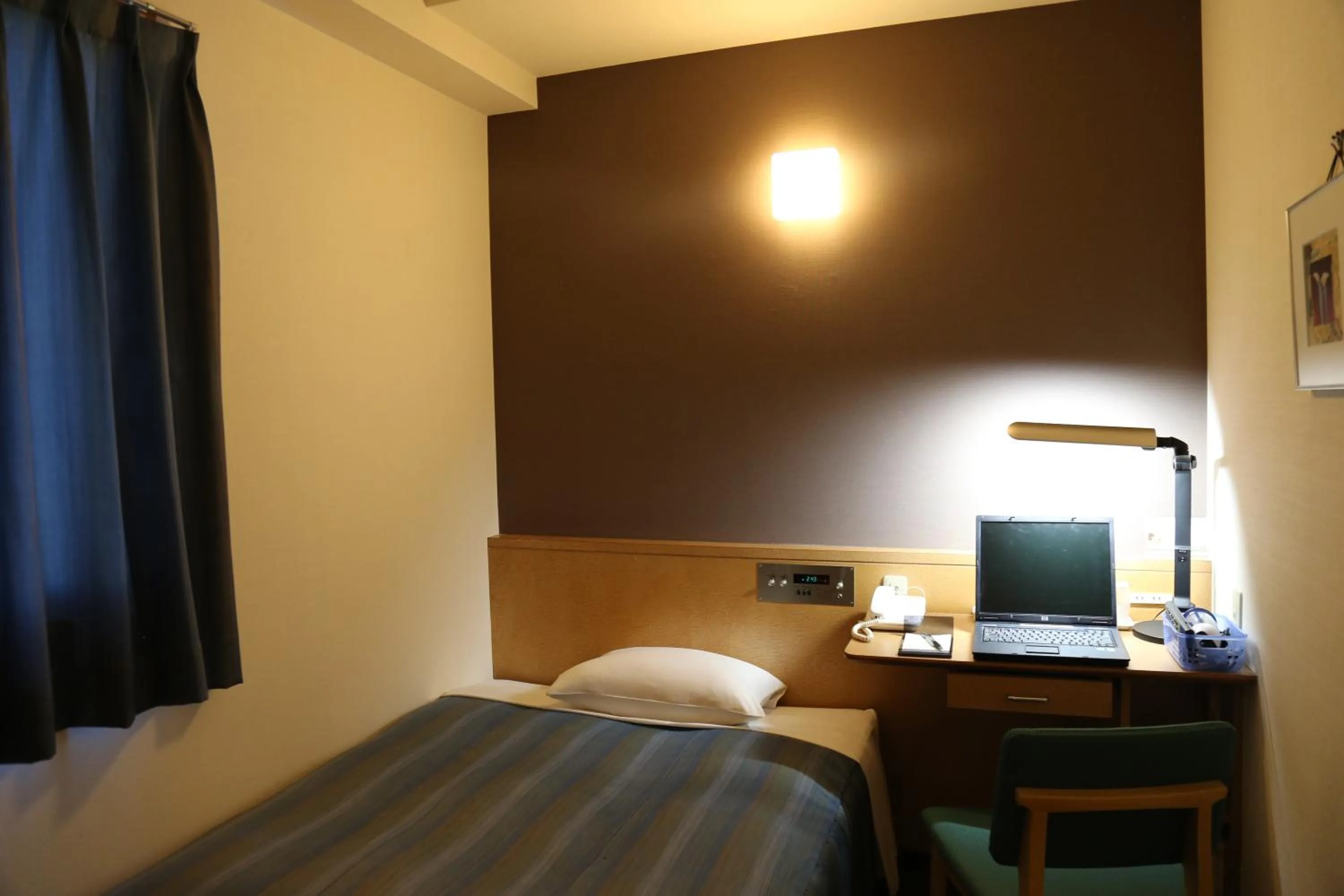 Bed in Hotel Plaza Arakawaoki