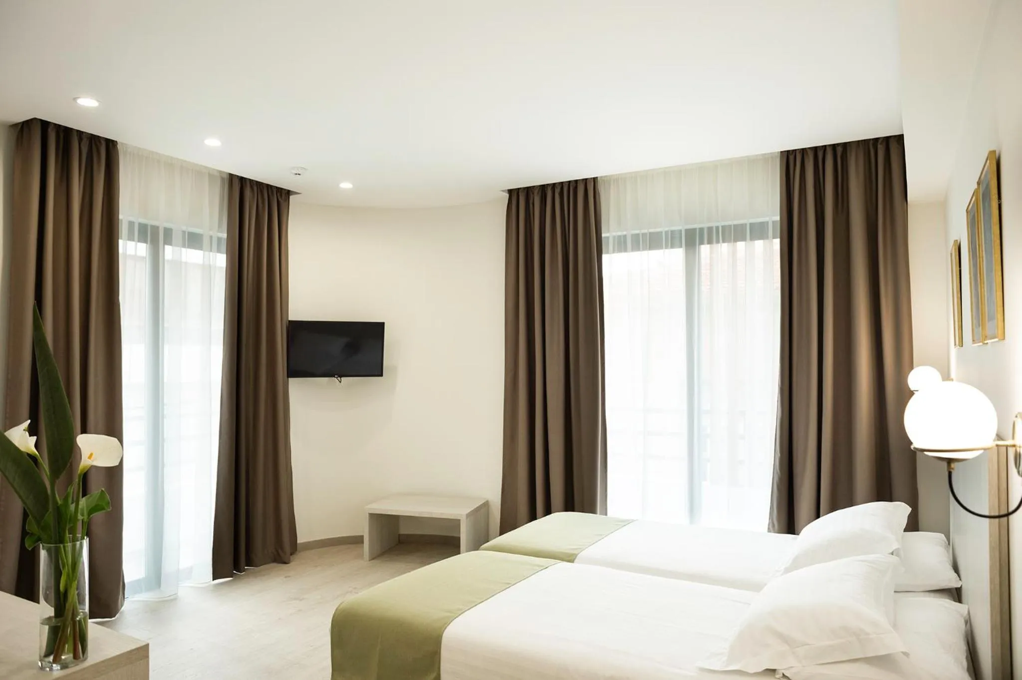 Bed in Roseum Boutique Hotel