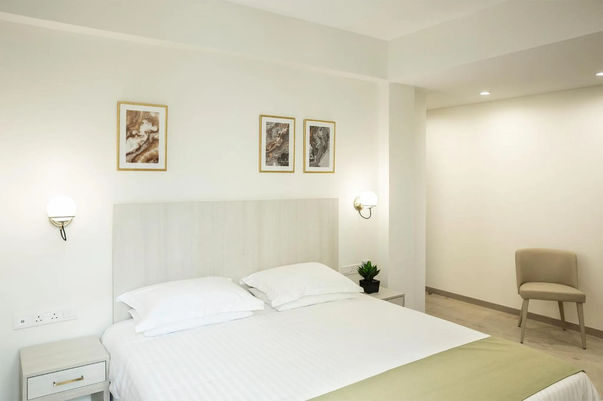 Bed in Roseum Boutique Hotel