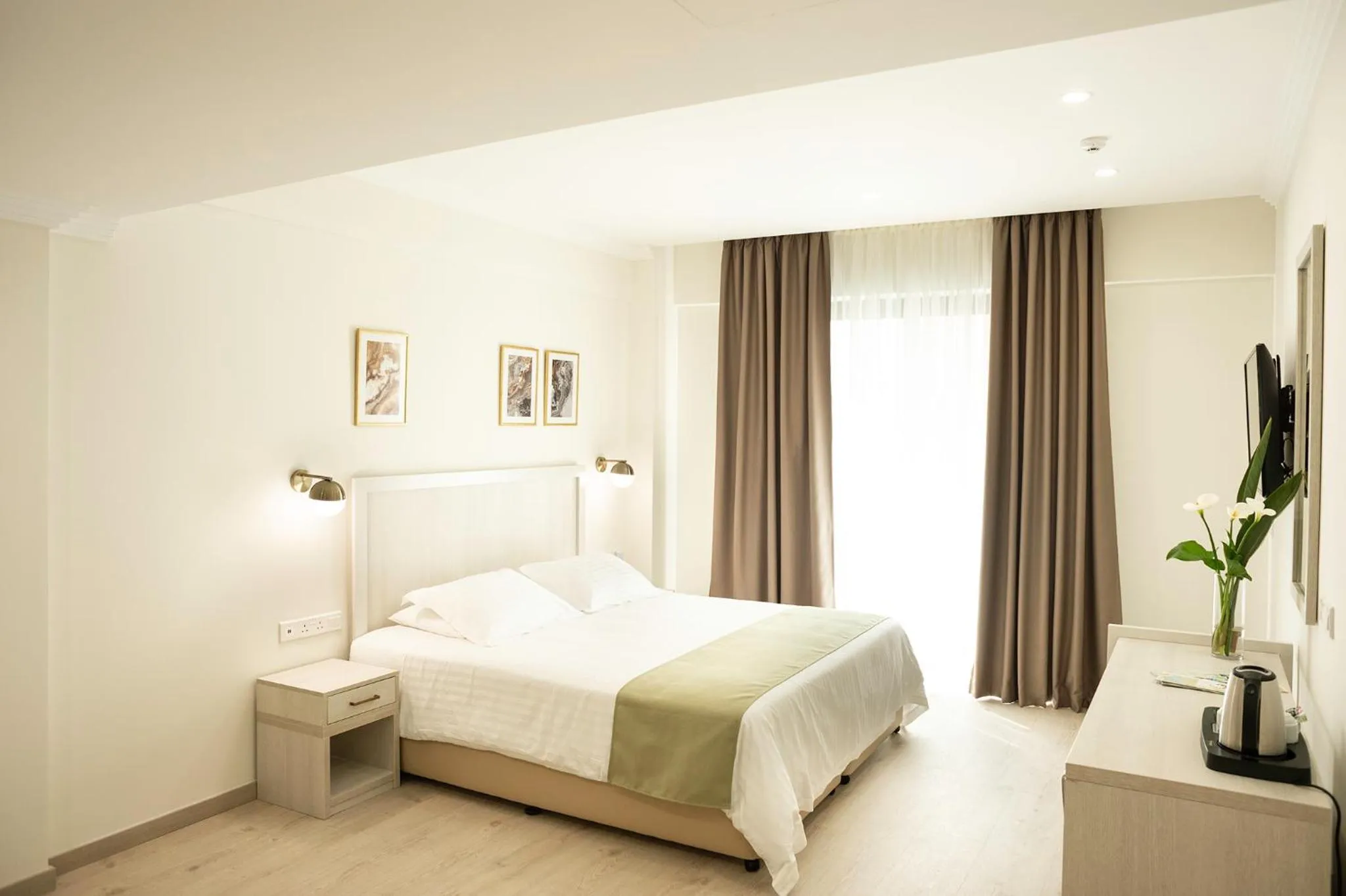 Bed in Roseum Boutique Hotel