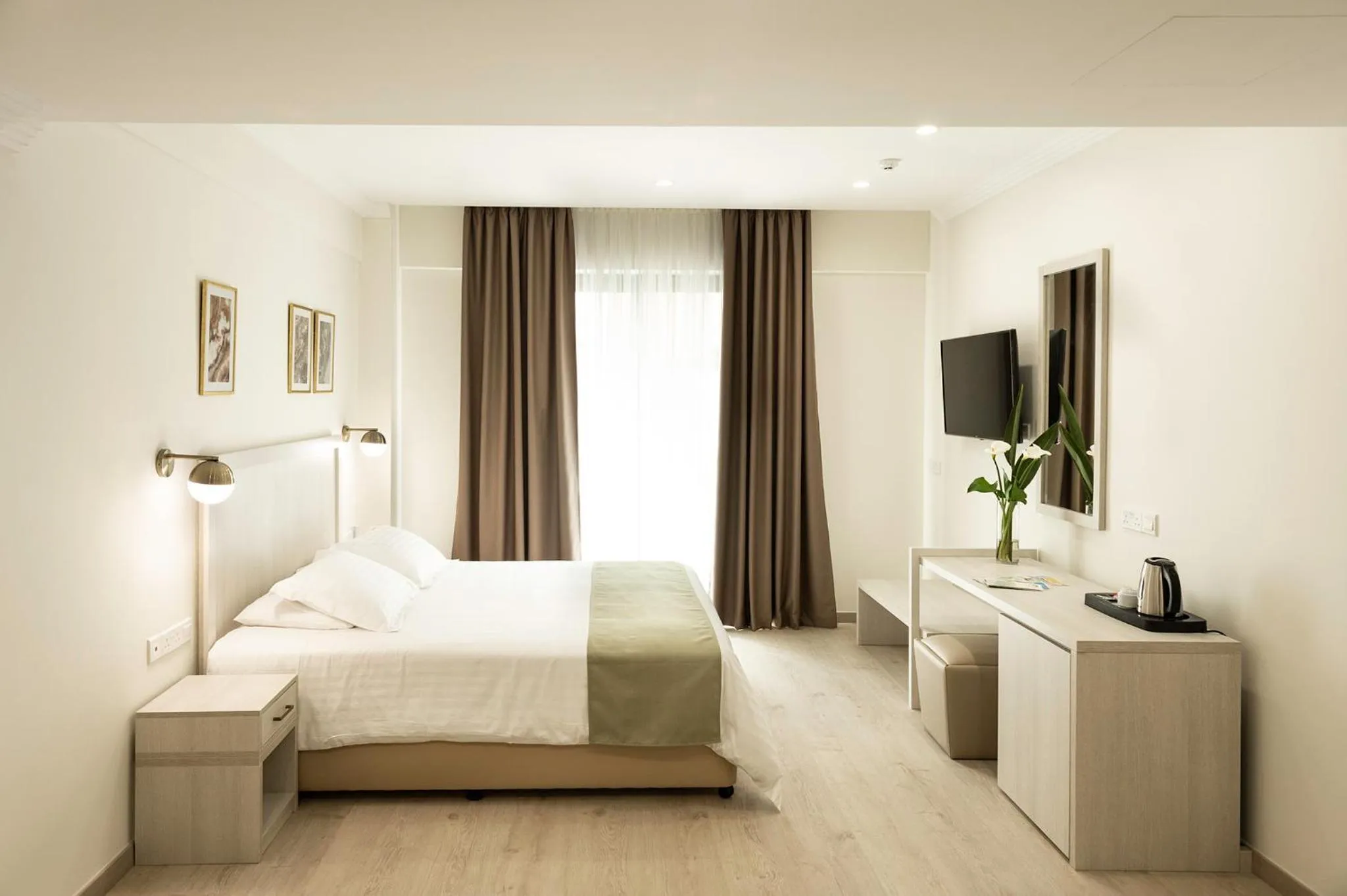 Bed in Roseum Boutique Hotel